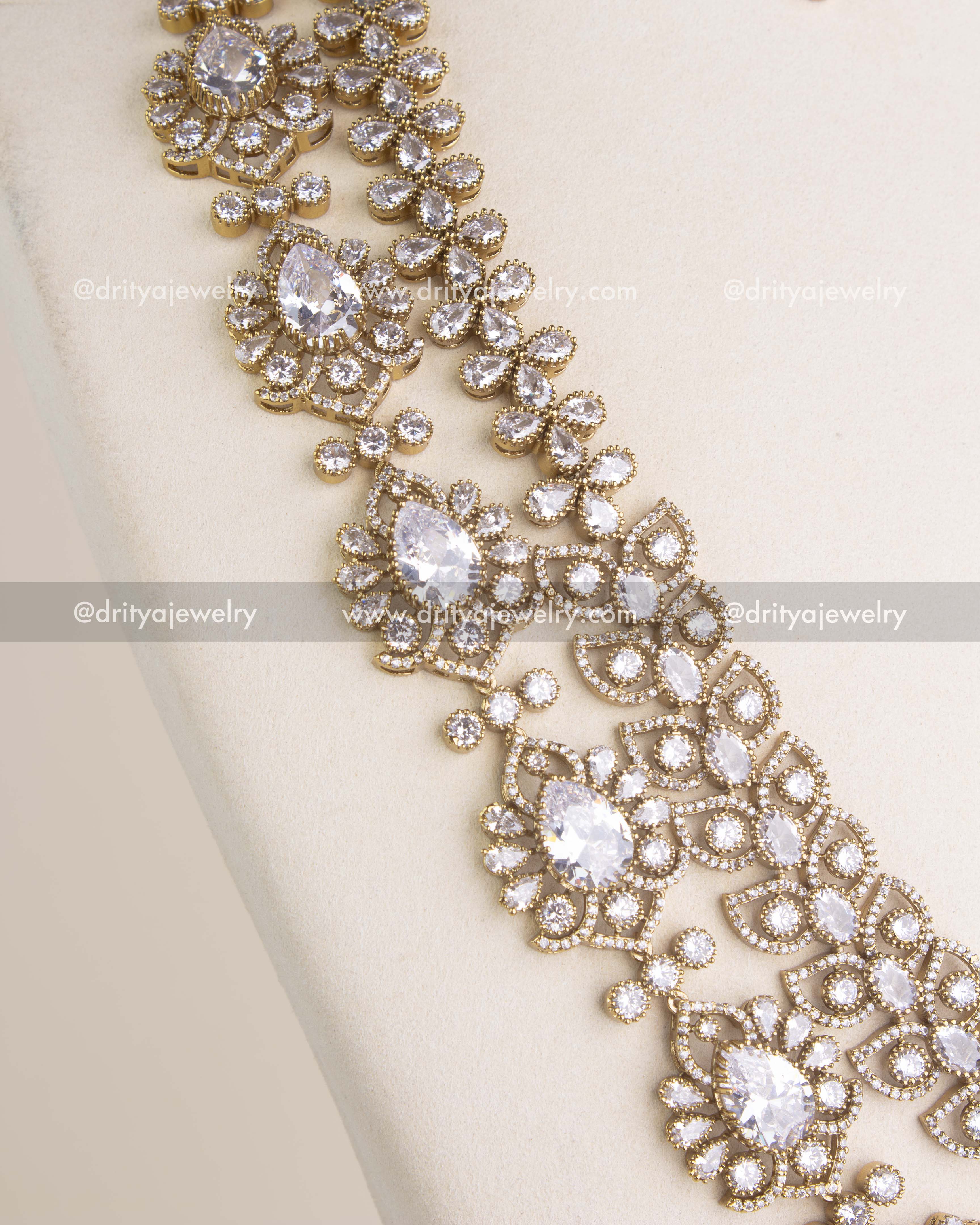 Angled view of the Victorian style necklace highlighting teardrop stone clusters