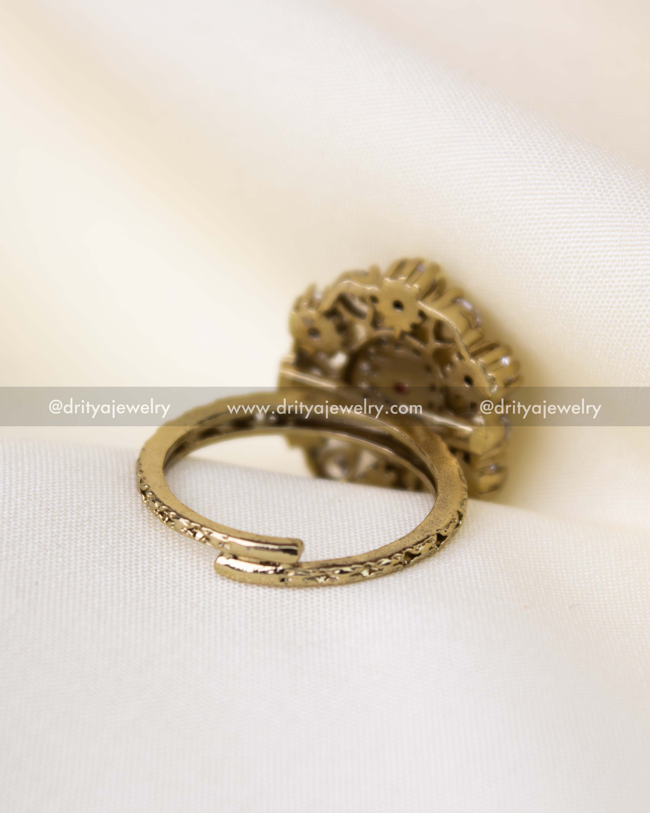 Adjustable traditional kundan ring with ruby red centerpiece and antique polish