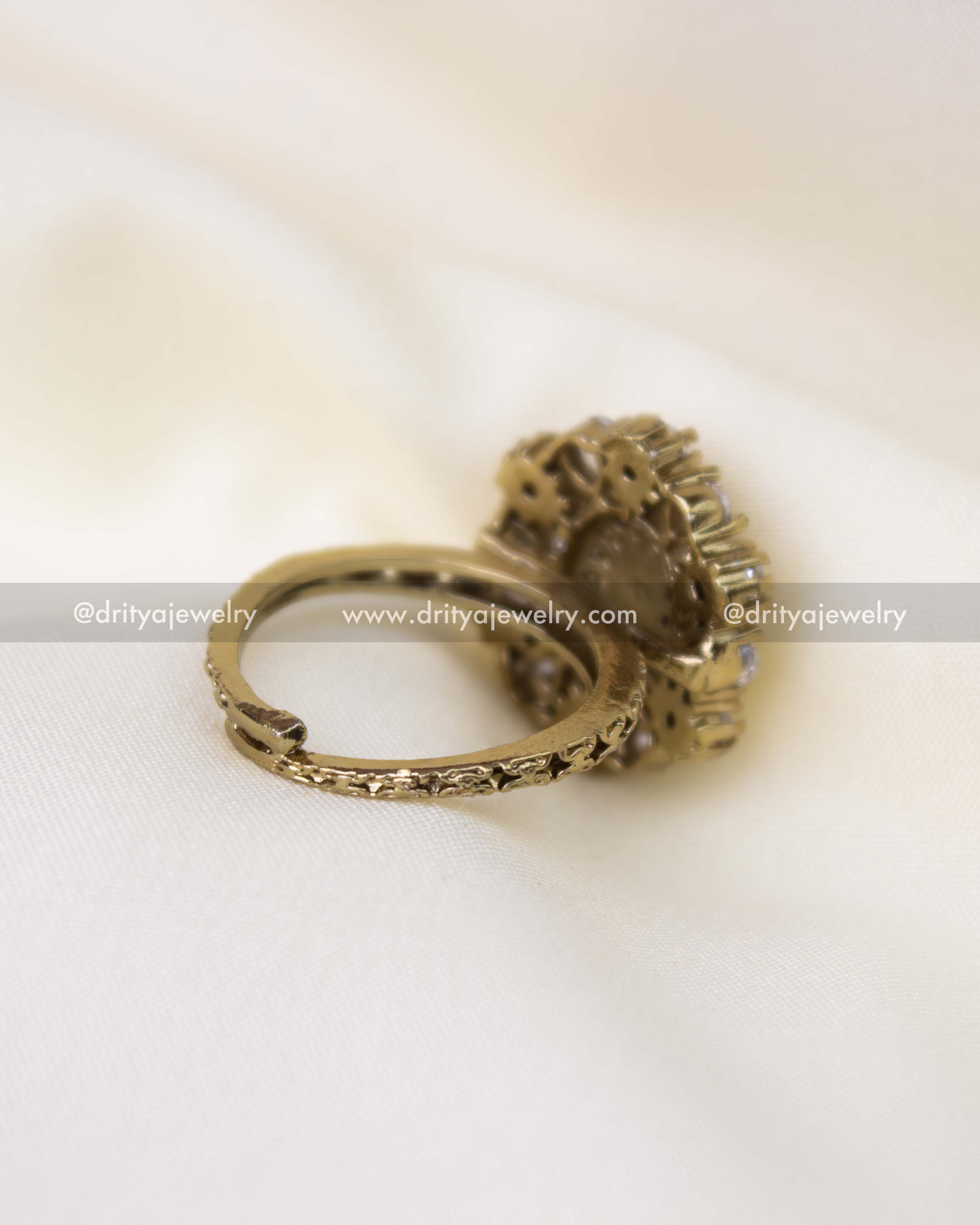 Adjustable antique polish kundan ring with sparkling white stones