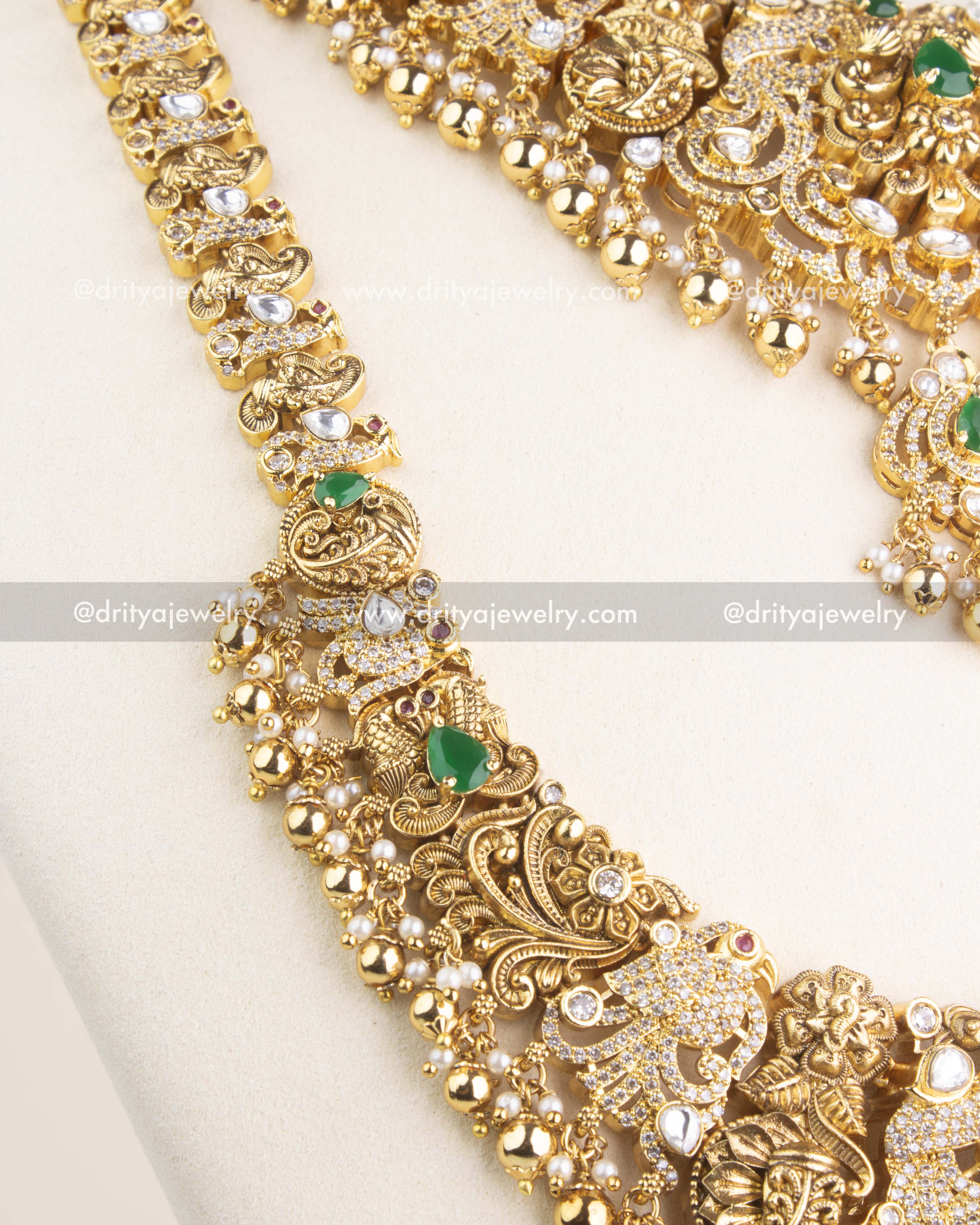 Zoomed-in view of the antique necklace chain featuring polki kundan work, green gemstones, and traditional nakshi craftsmanship.