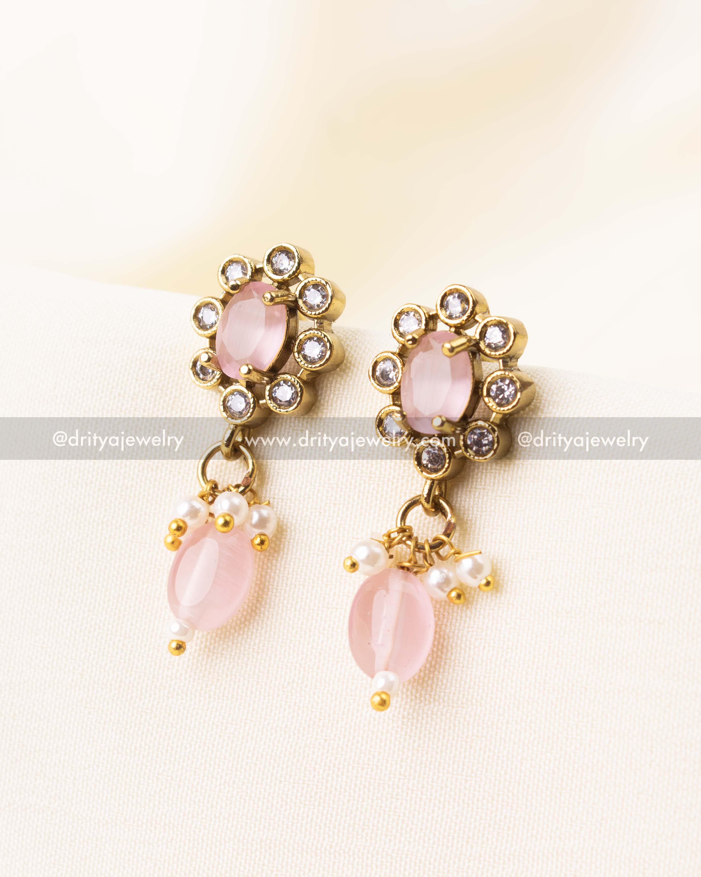 Coordinated blush pink stud earrings with delicate drop beads and faux pearls.