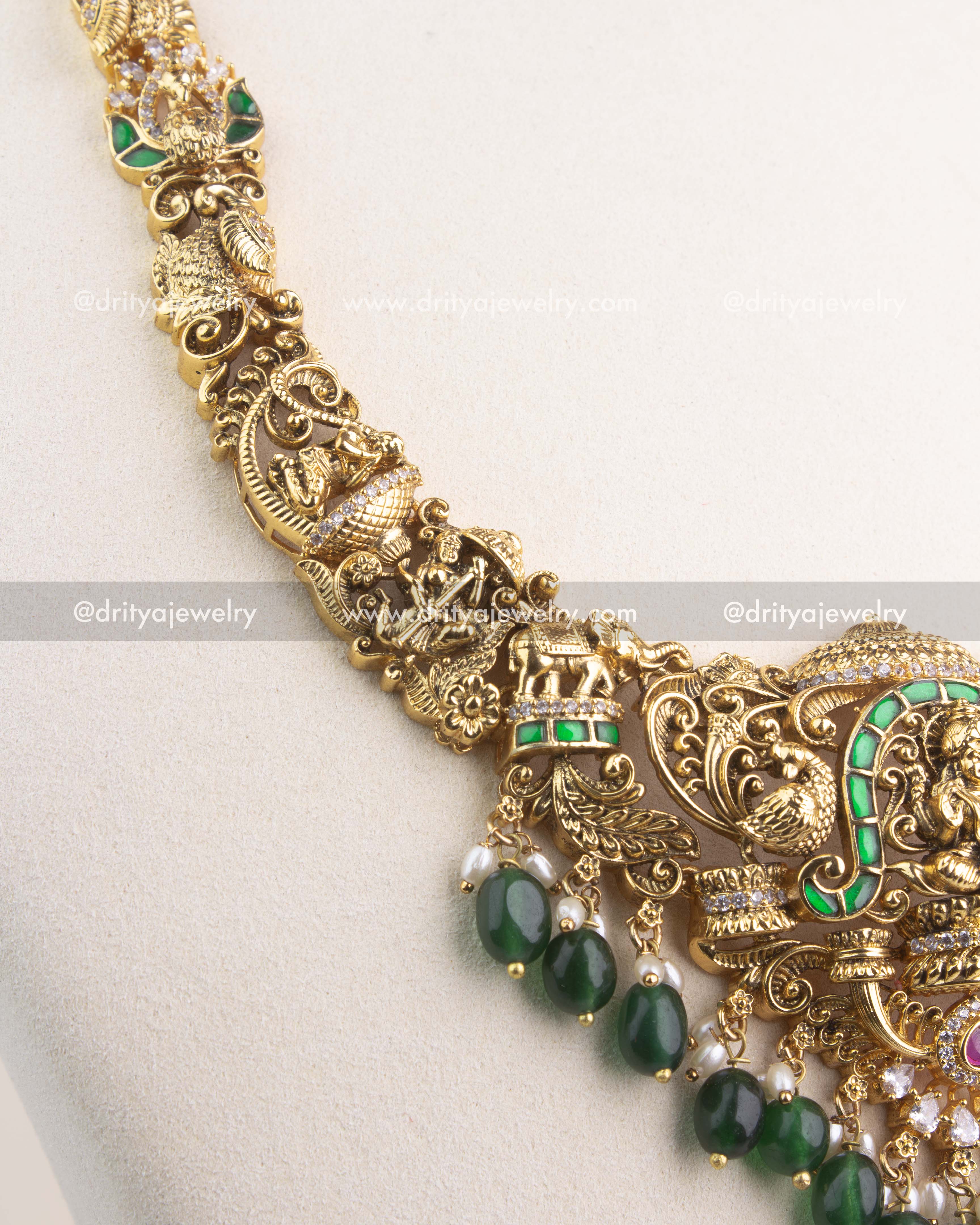 Handcrafted Nakshi chain with intricate carvings of peacocks and temple motifs.
