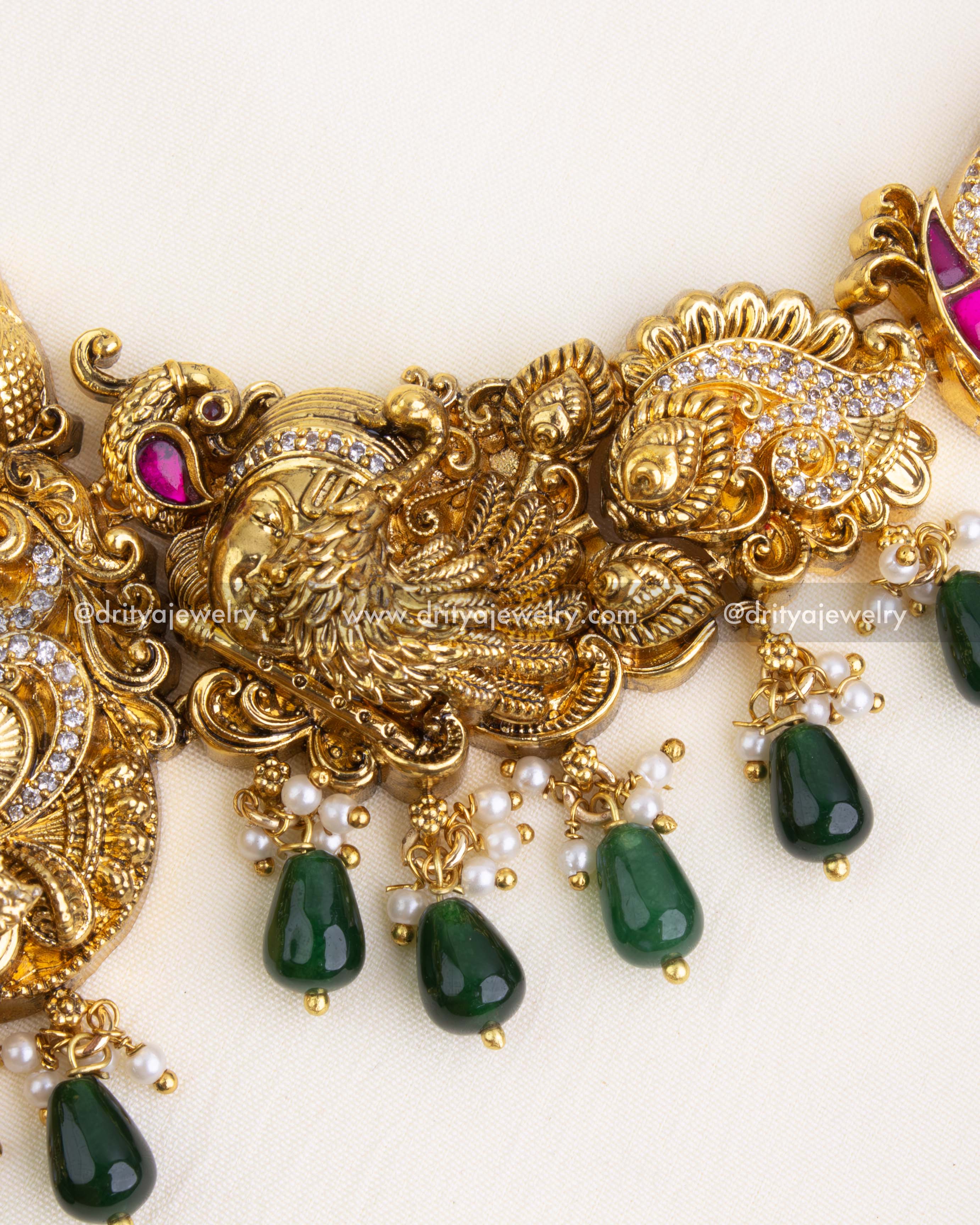 Intricately designed chain with peacock, goddess, and floral Nakshi carvings.