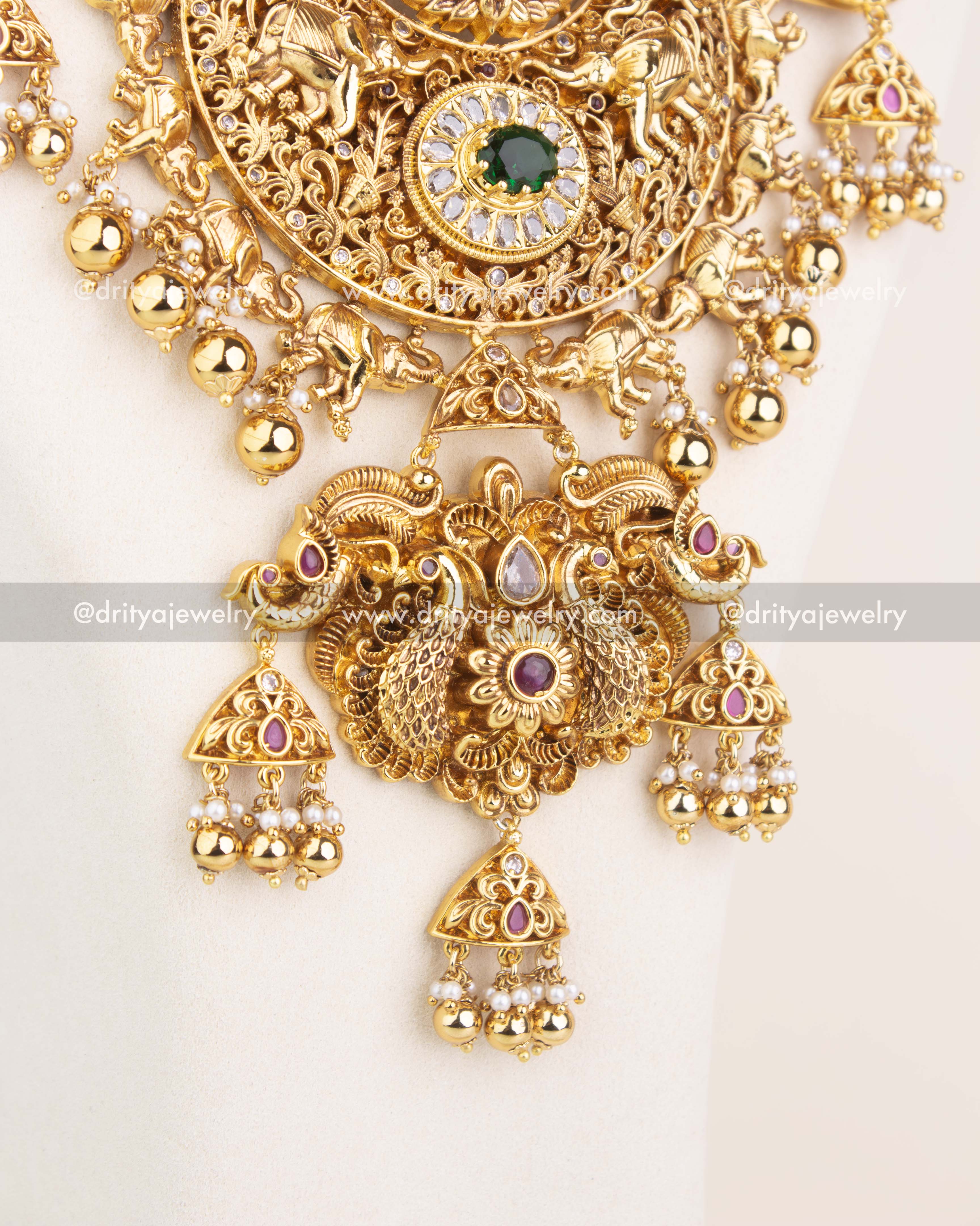 Detailed pendant design featuring Lakshmi, animal motifs, and CZ stone embellishments in antique polish.
