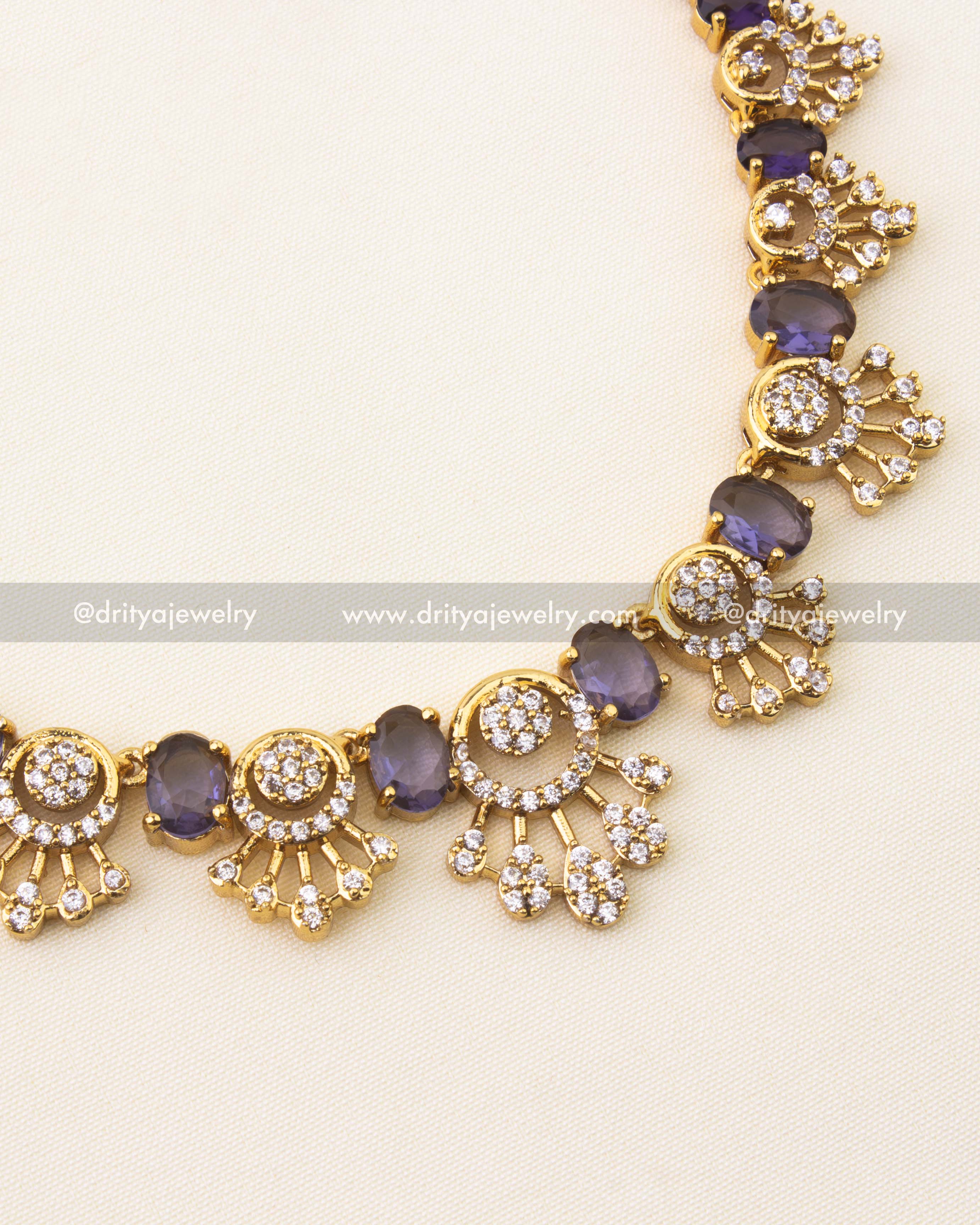 Detailed view of short necklace featuring purple stones and CZ cluster motifs.