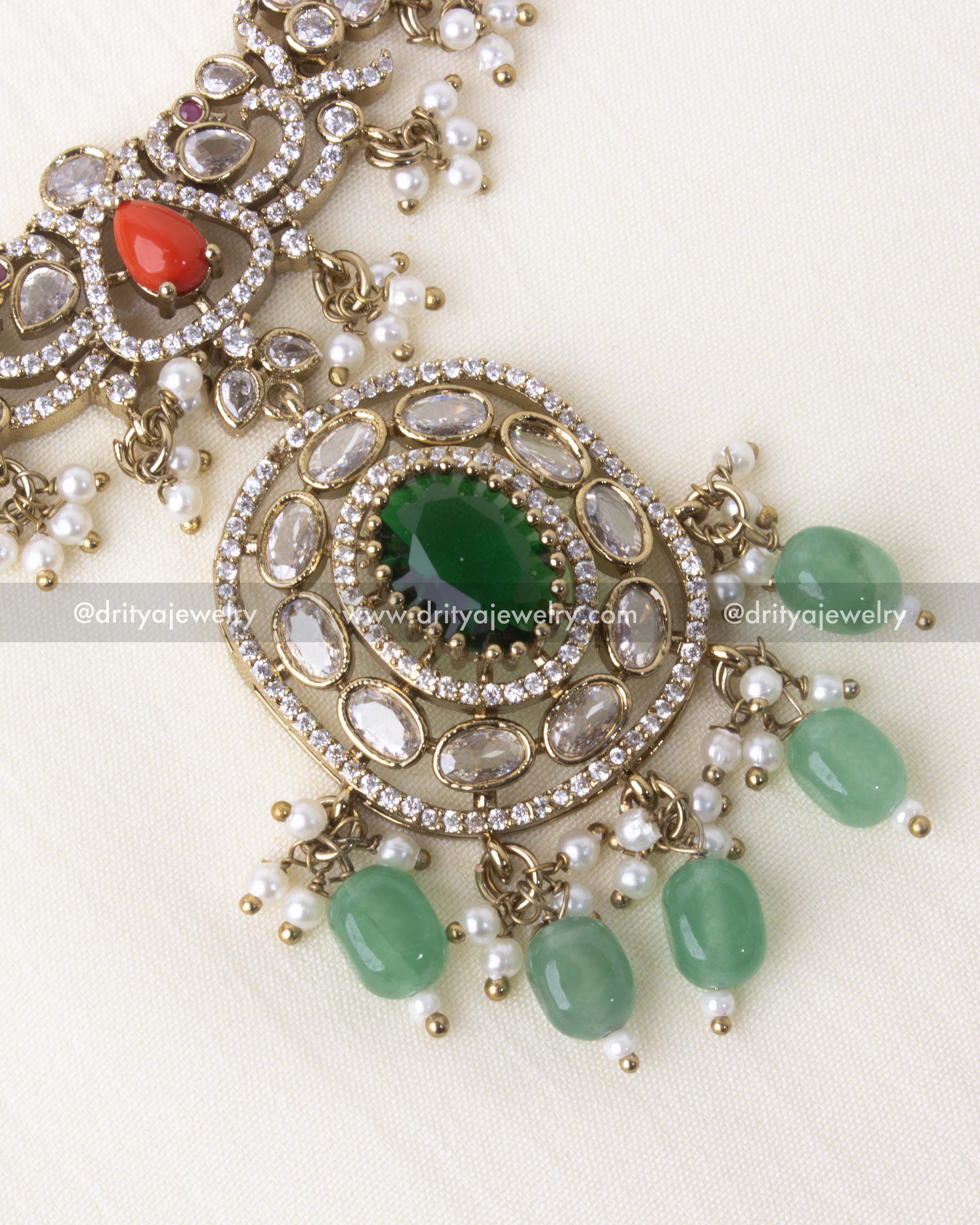 Detailed view of green center pendant with kundan-style CZ stones and hanging green coral beads.