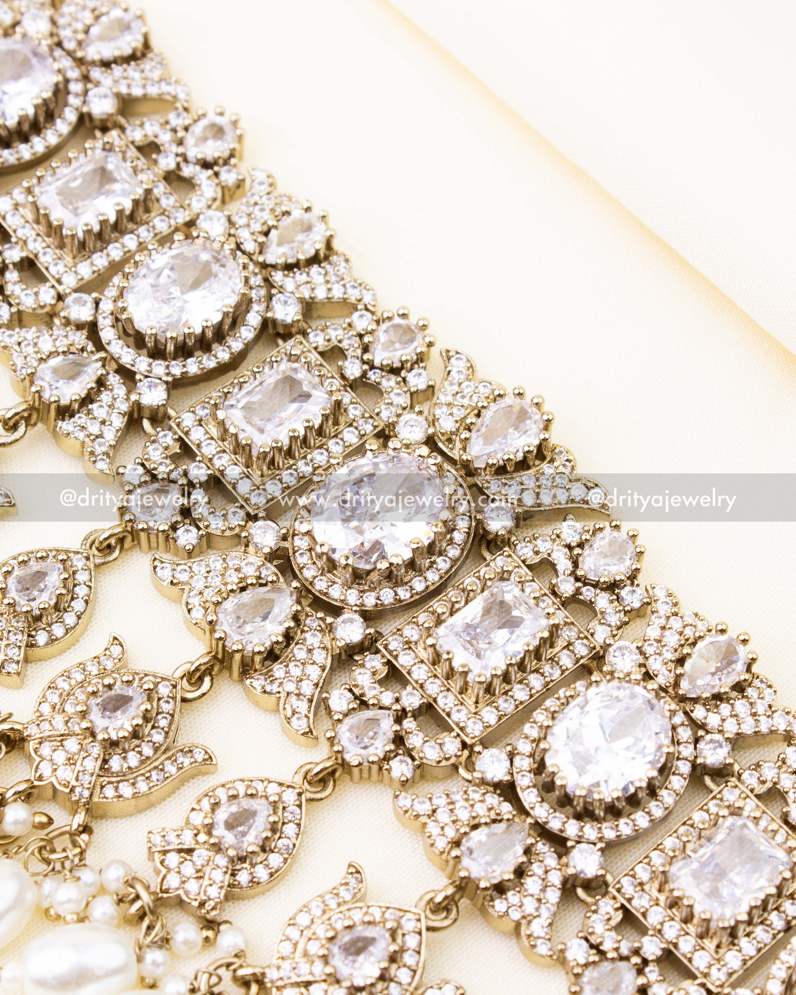 Detailed diamond look bridal choker with AD stones and pearls.