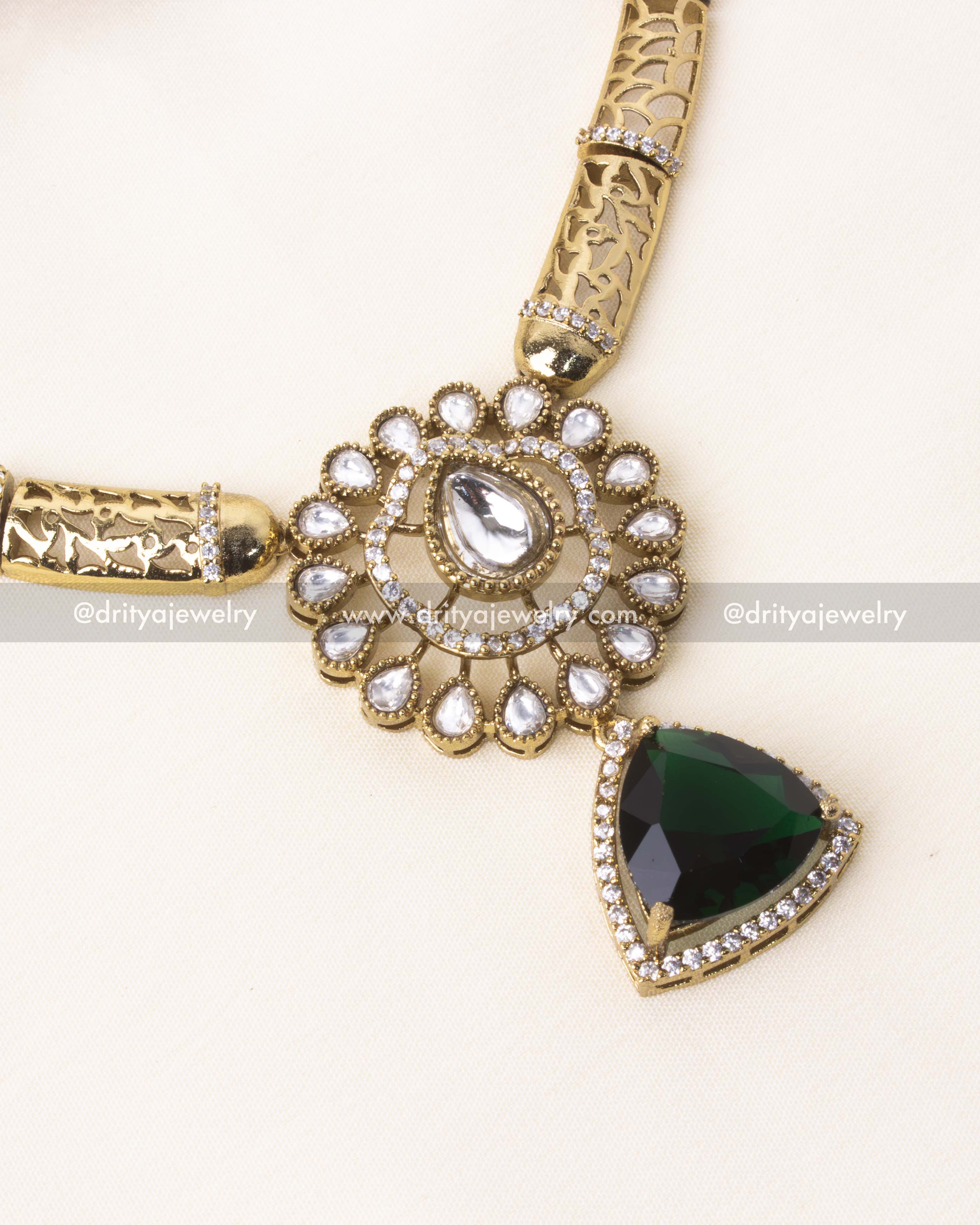 Detailed close-up of emerald green pendant on premium Kanti short necklace.