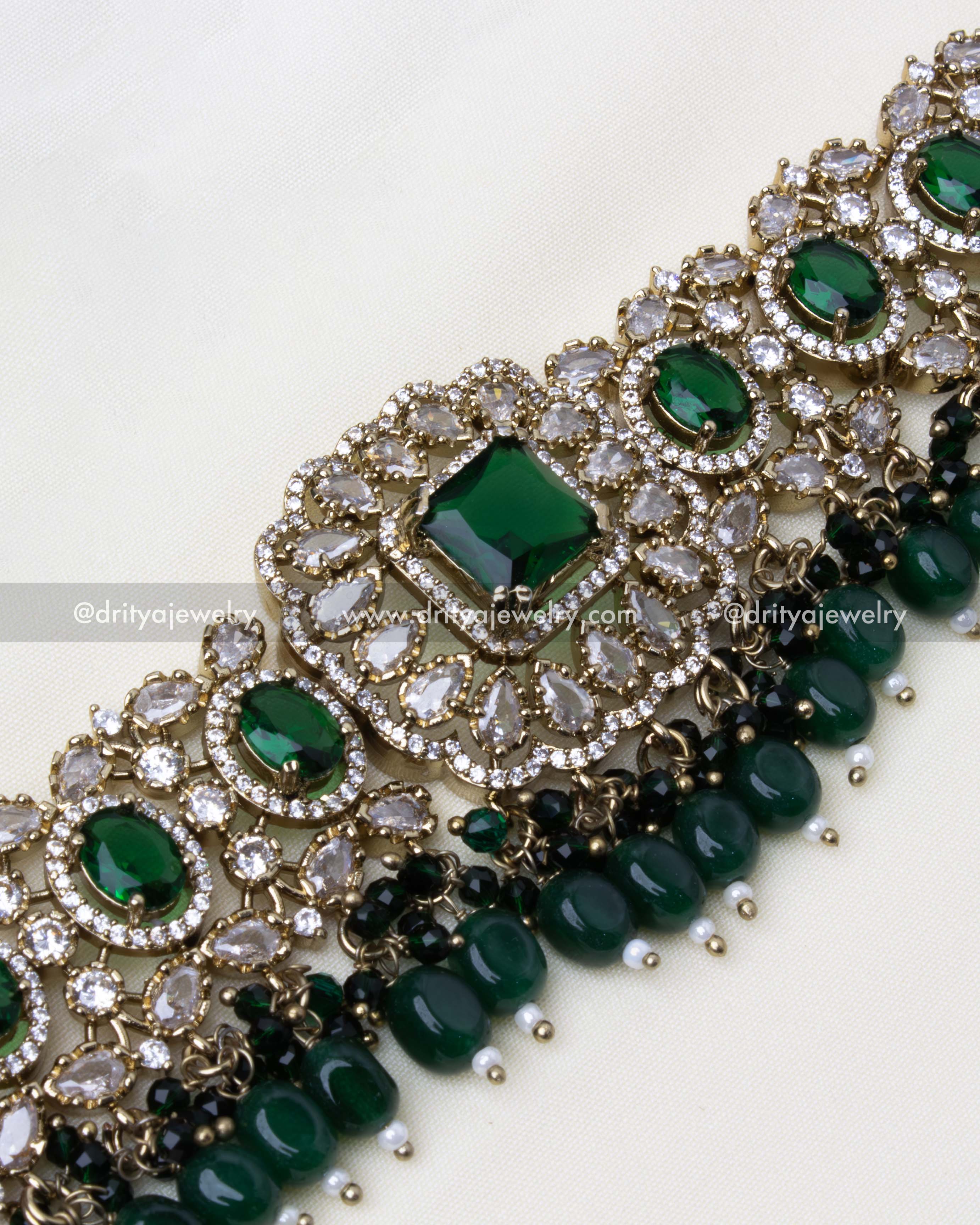 Close-up view of choker featuring AD stones, emerald beads, and antique finish.