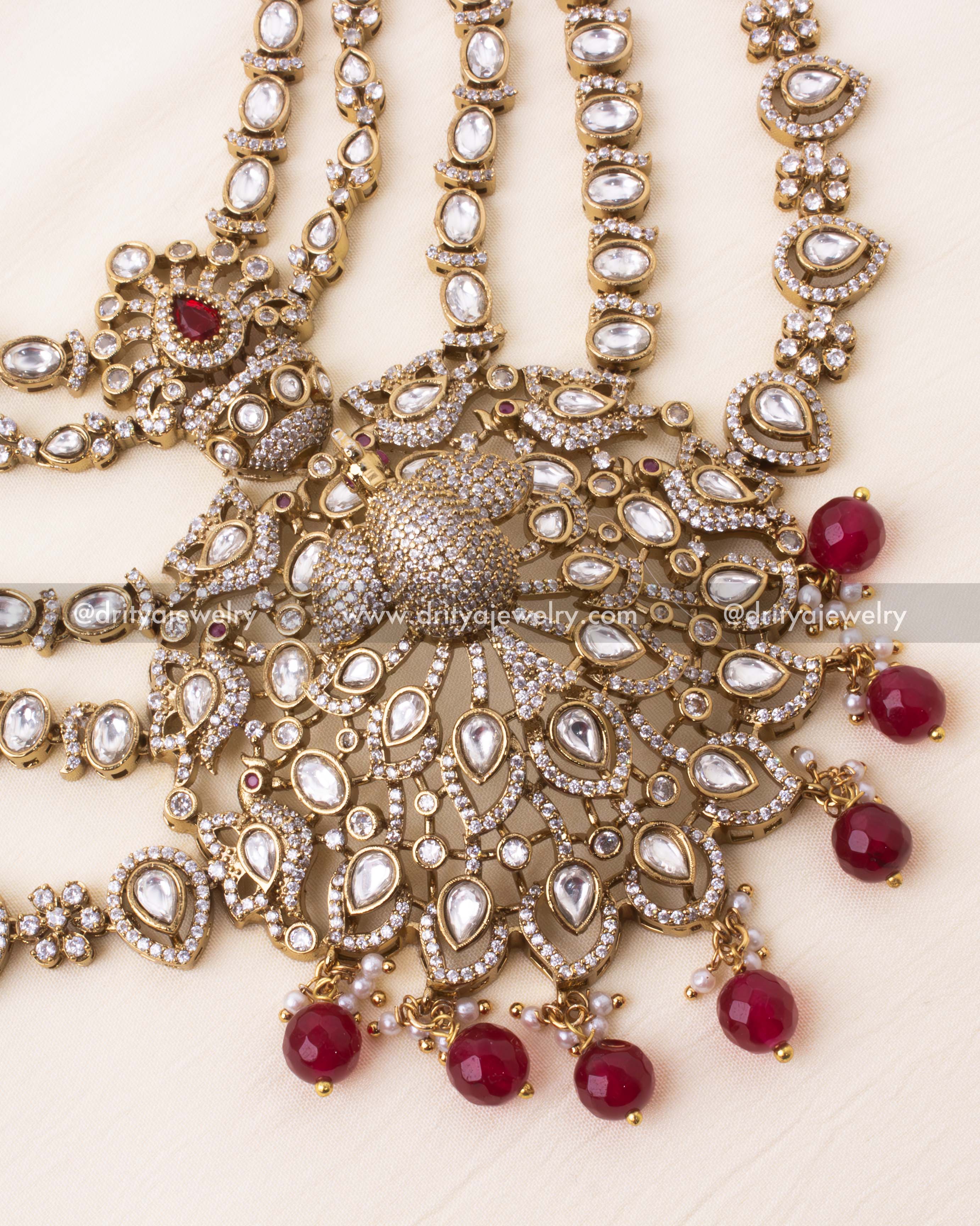 Detailed view of the Kundan polki-studded peacock motif pendant with ruby beads.