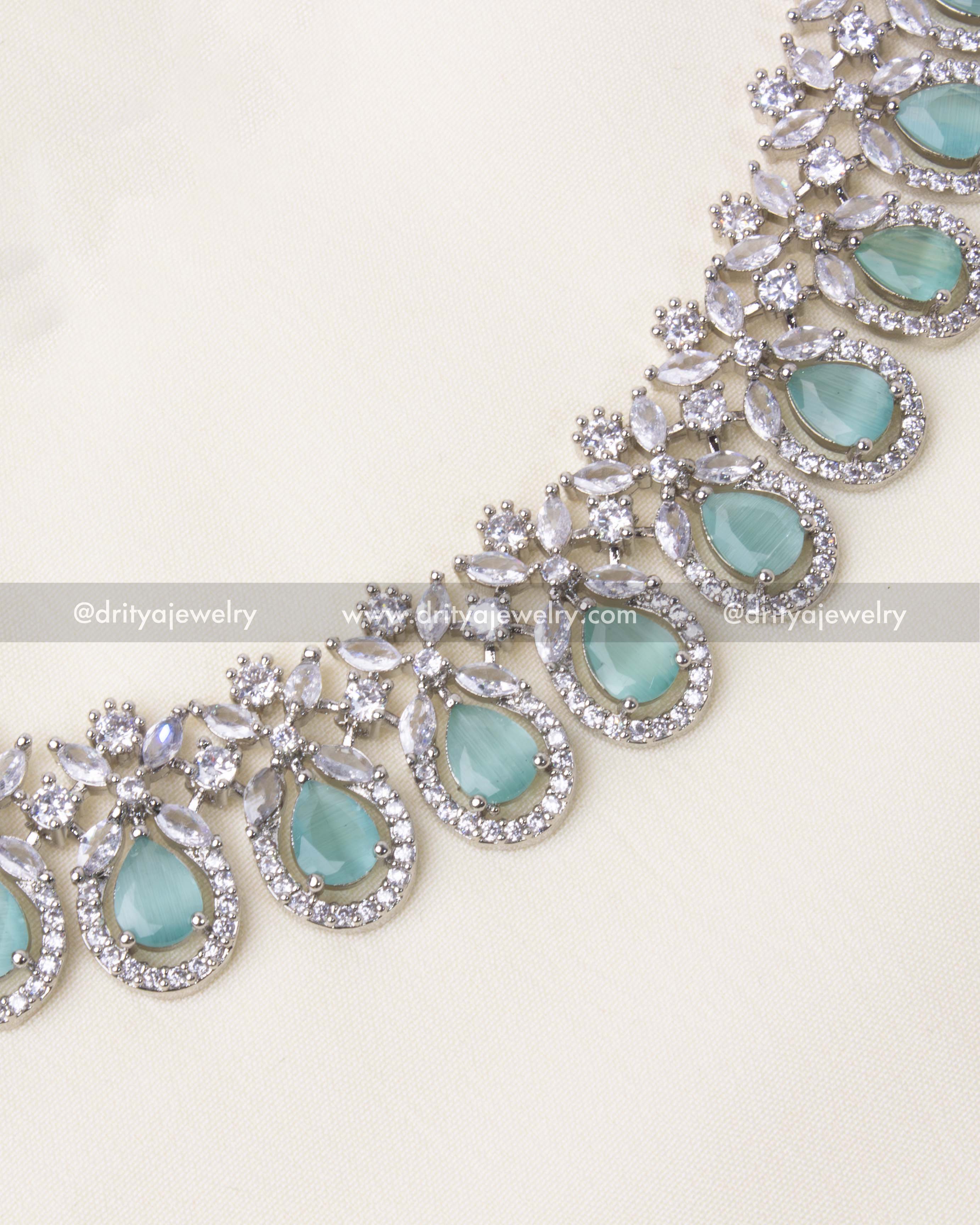 Close-Up of Mint Zircon Necklace Design" Alt Text: "Close-up of mint zircon necklace with intricate CZ stonework.