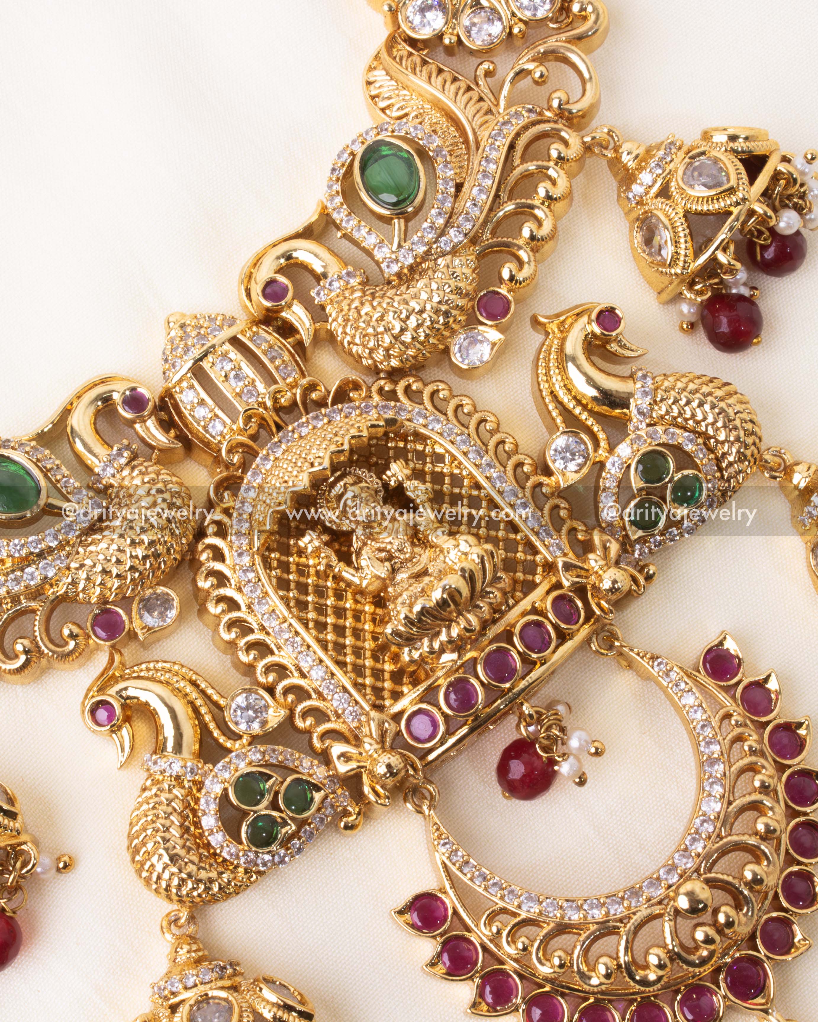 Detailed central pendant featuring goddess Lakshmi, peacocks, and traditional temple-style craftsmanship.