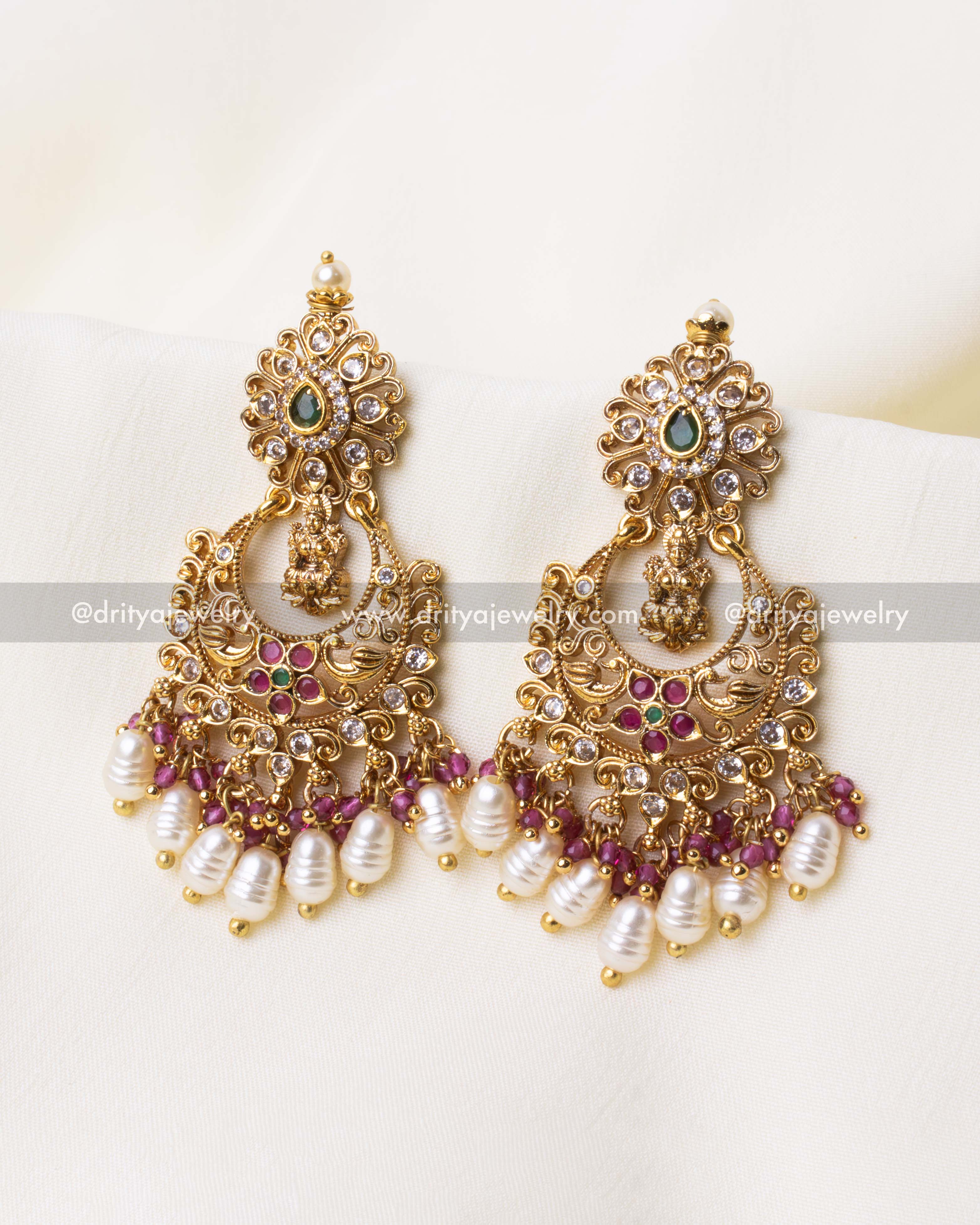Detailed view of gold-plated pink Chandbali earrings with AD stones and pearl beadwork.