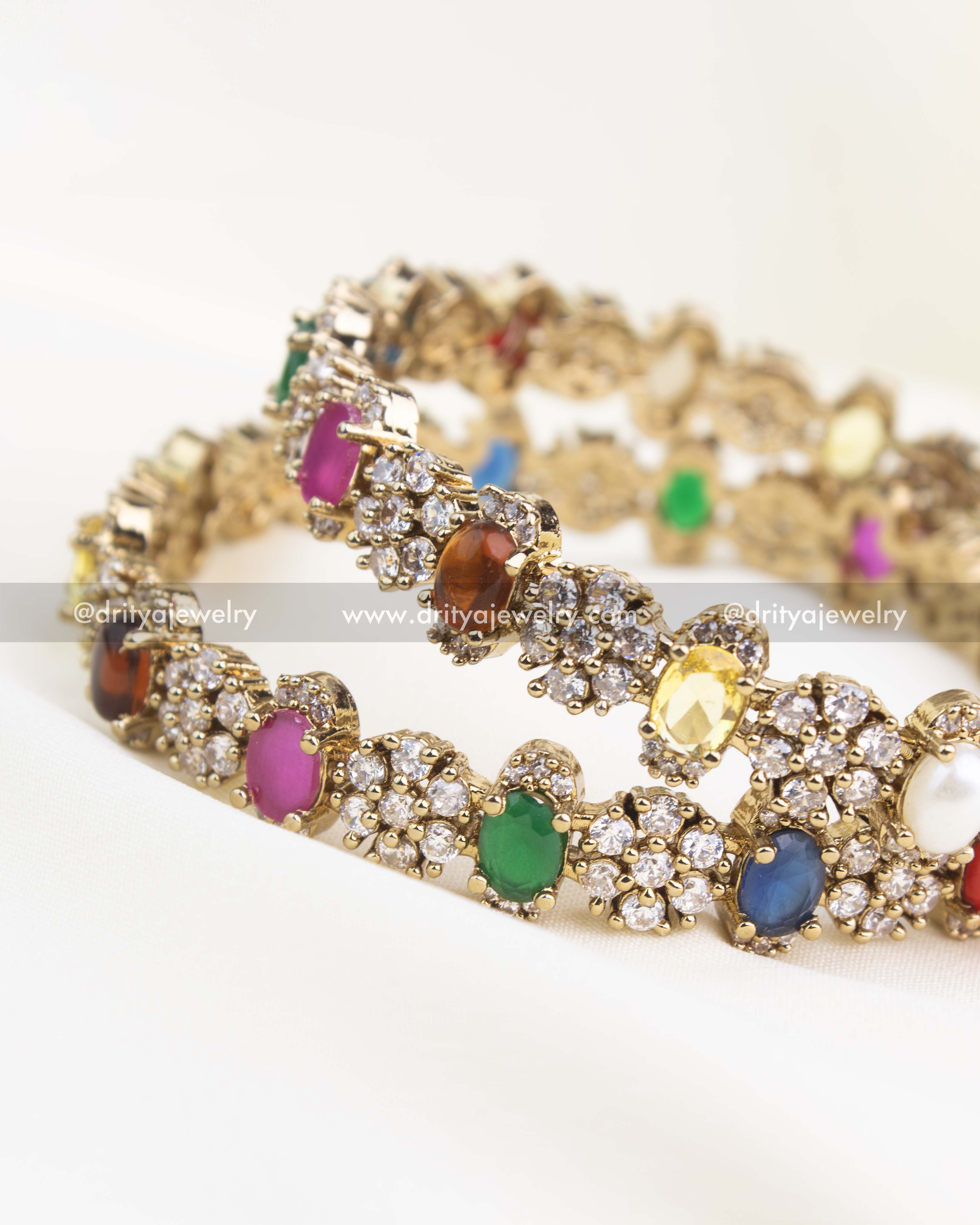 Close-up showing intricate Victorian detailing with colorful stones and white CZ highlights.