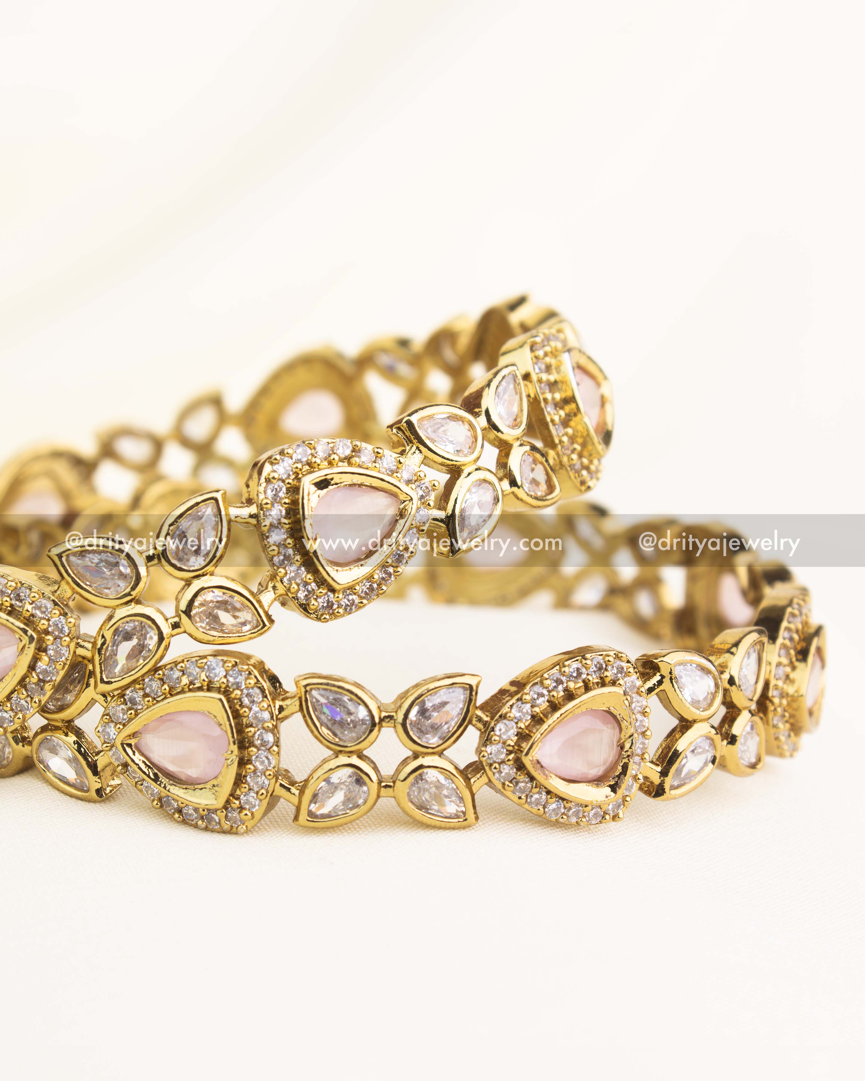 Close-up showing blush pink AD stones set in intricate Victorian gold finish.