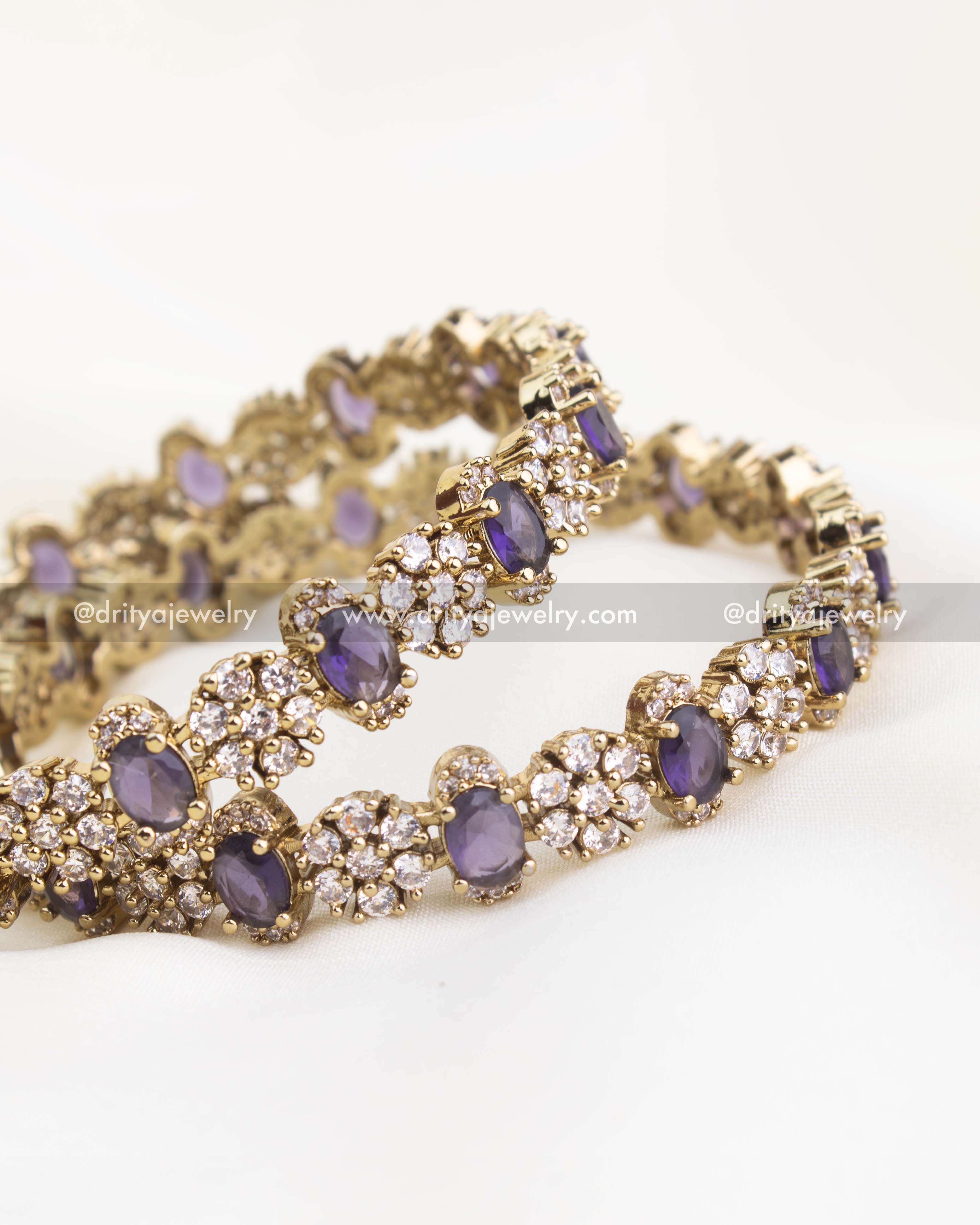 Close-up showing intricate craftsmanship and royal purple stones set in CZ floral pattern.