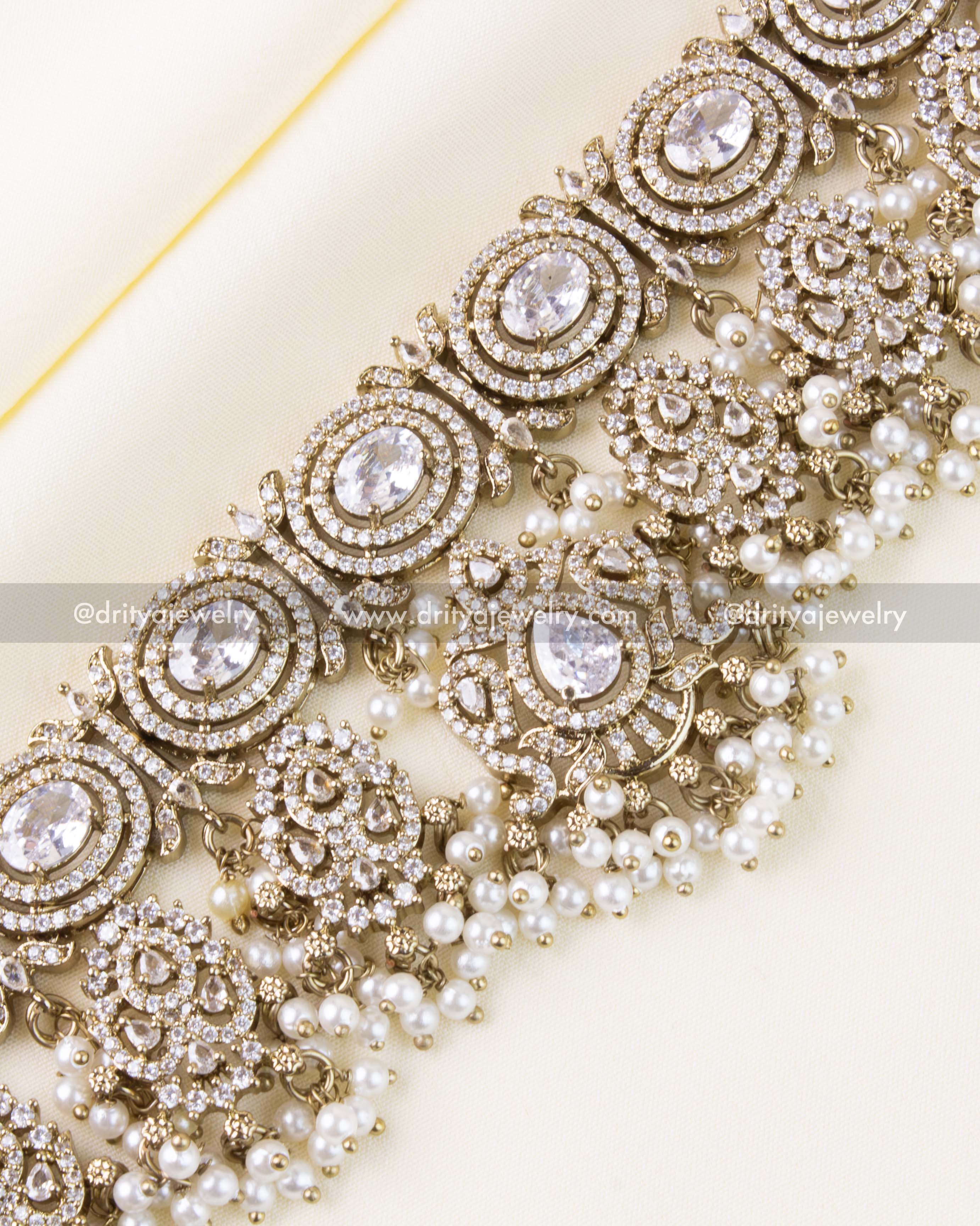 Zoomed view of diamond-like AD stones and Victorian pattern with pearls.