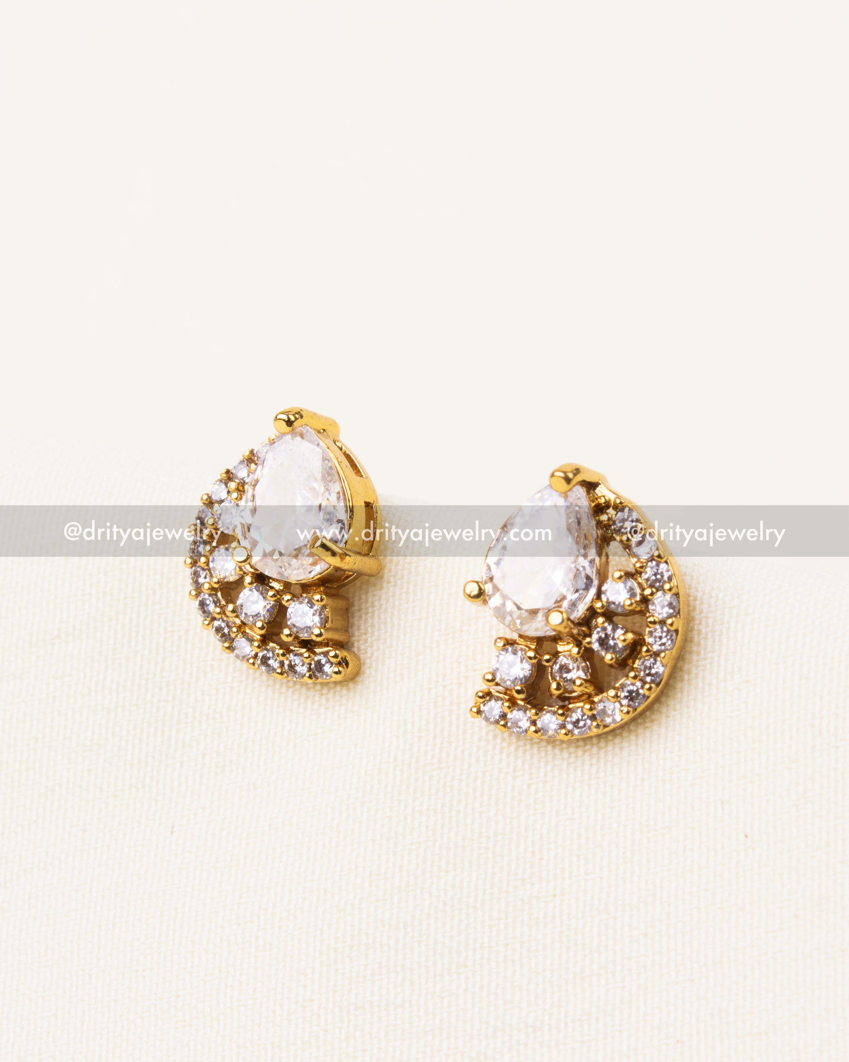 Elegant clear diamond-alike pear CZ stud earrings with a halo of CZ stones.