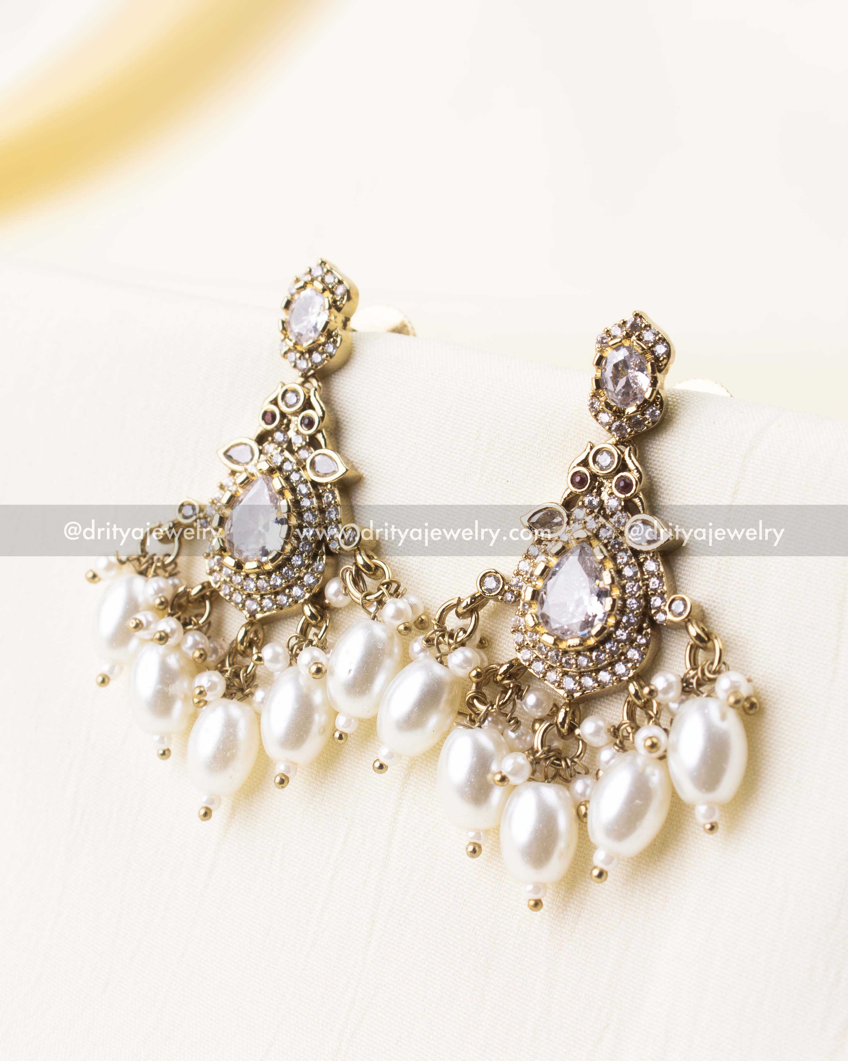 Sparkling AD stones with pearl bead accents.