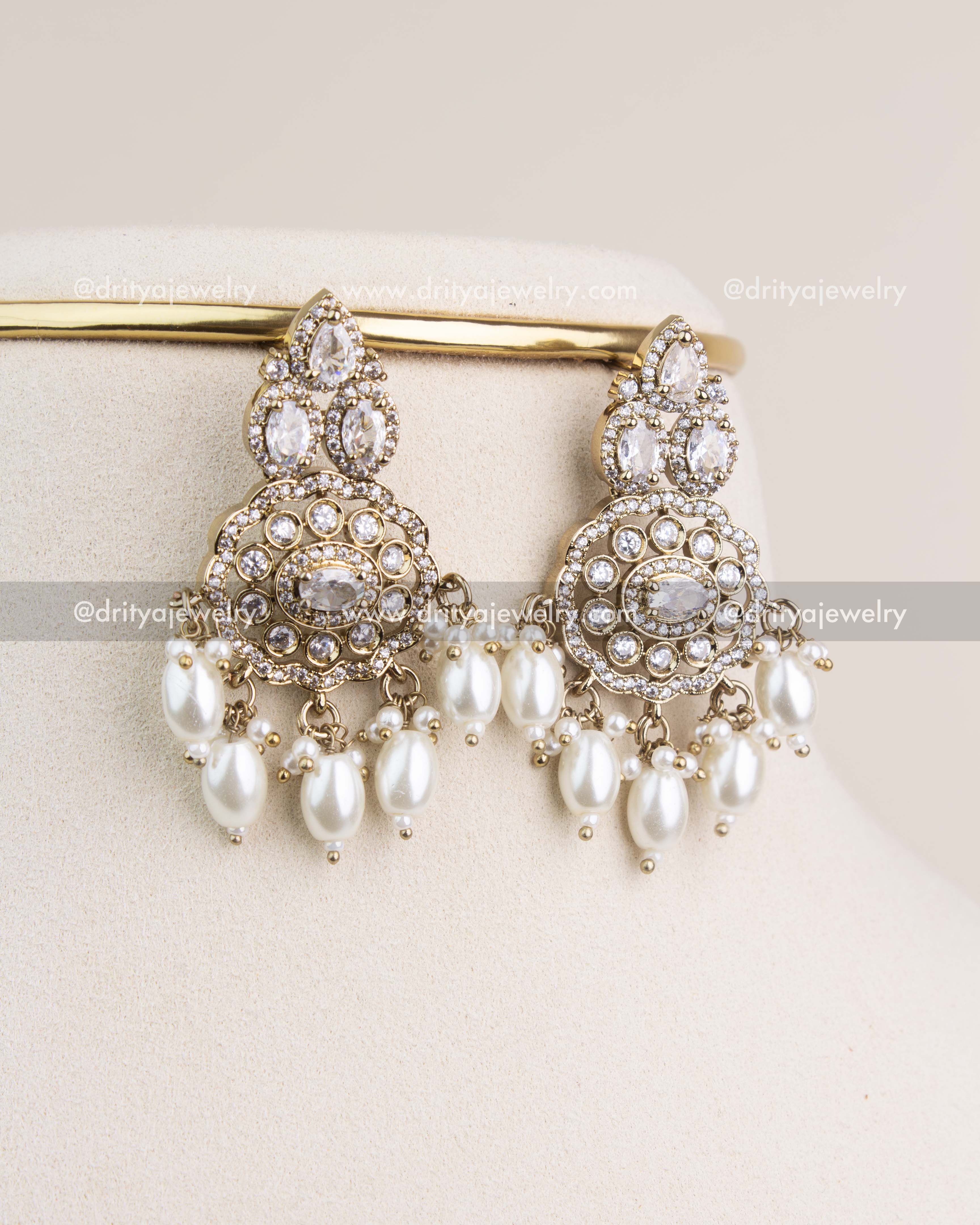 Statement Victorian earrings with diamond white CZ crystals and oval pearls for elegant looks.