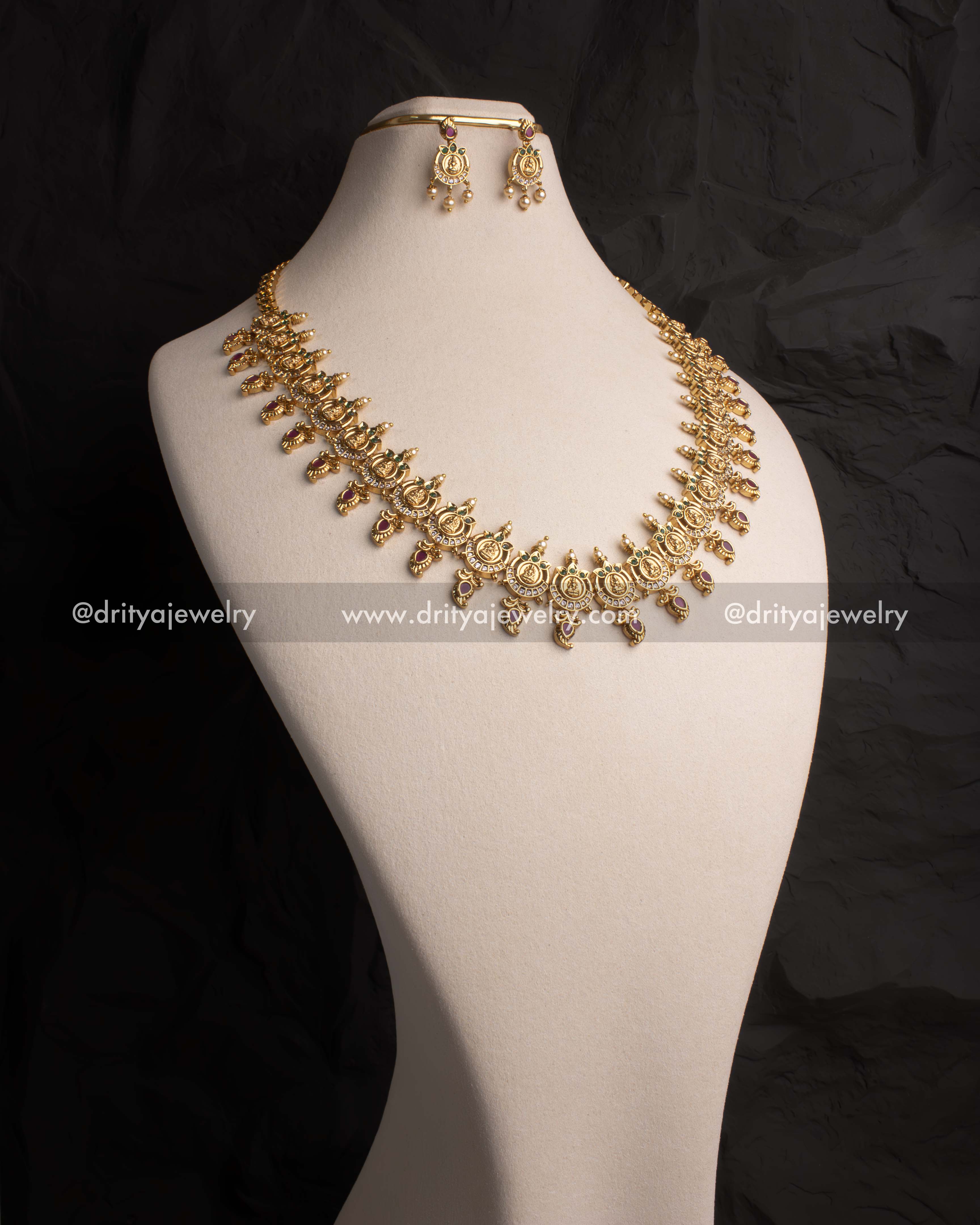 Elegant long necklace set featuring Lakshmi Devi coin motifs and polki stones with gold plating, ideal for weddings and festivities.