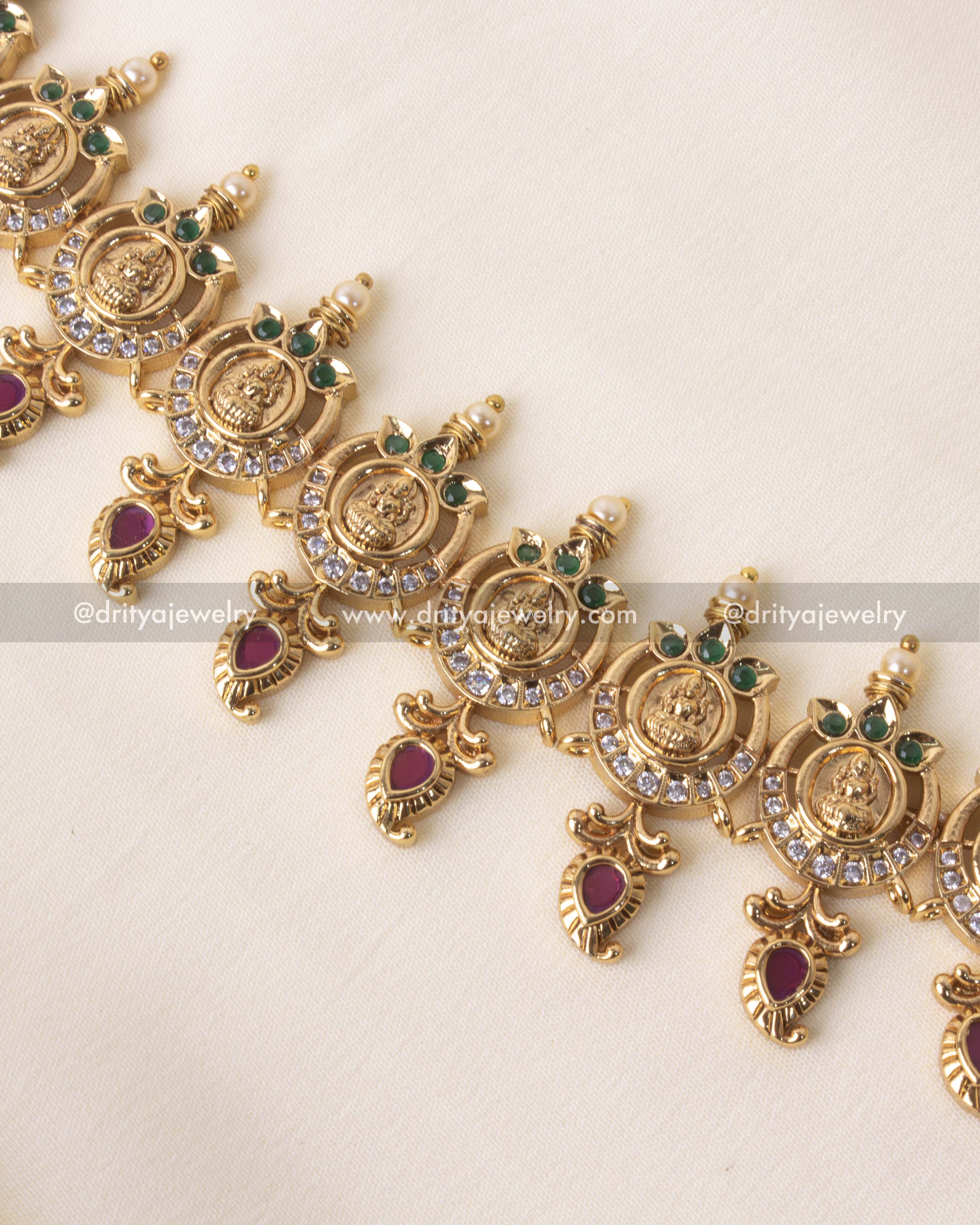 Elegant long necklace set featuring Lakshmi Devi coin motifs and polki stones with gold plating, ideal for weddings and festivities.