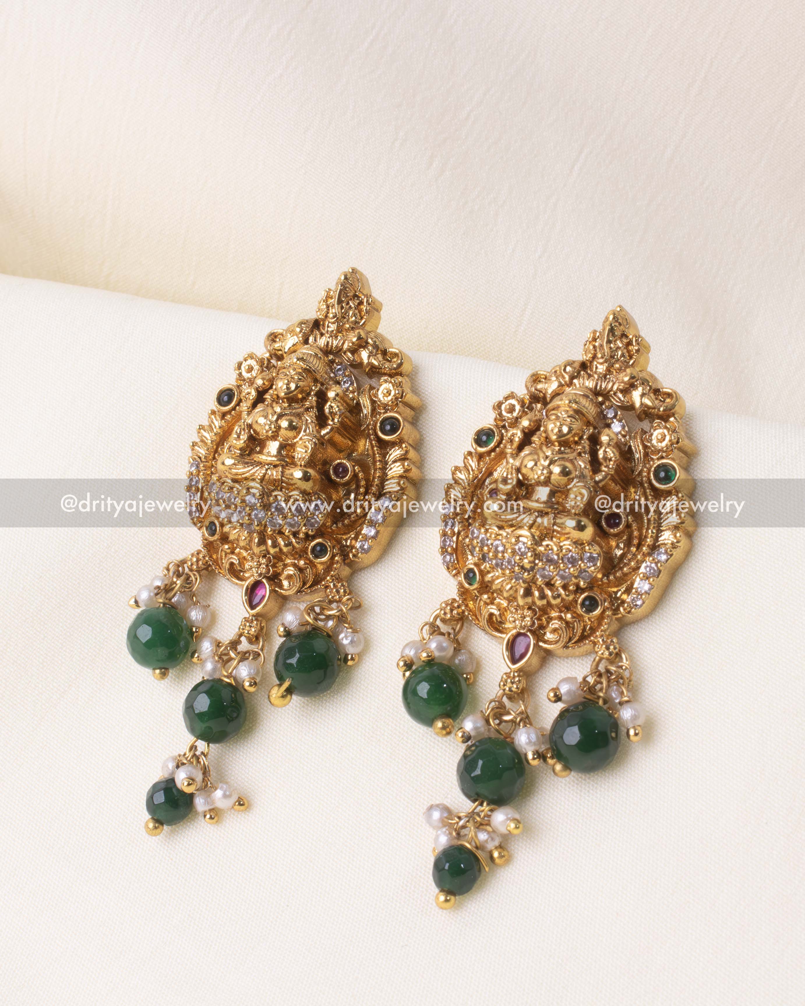 Opulent long Lakshmi Devi necklace set with intricate gold plating and vibrant bead details, ideal for festive and formal occasions.