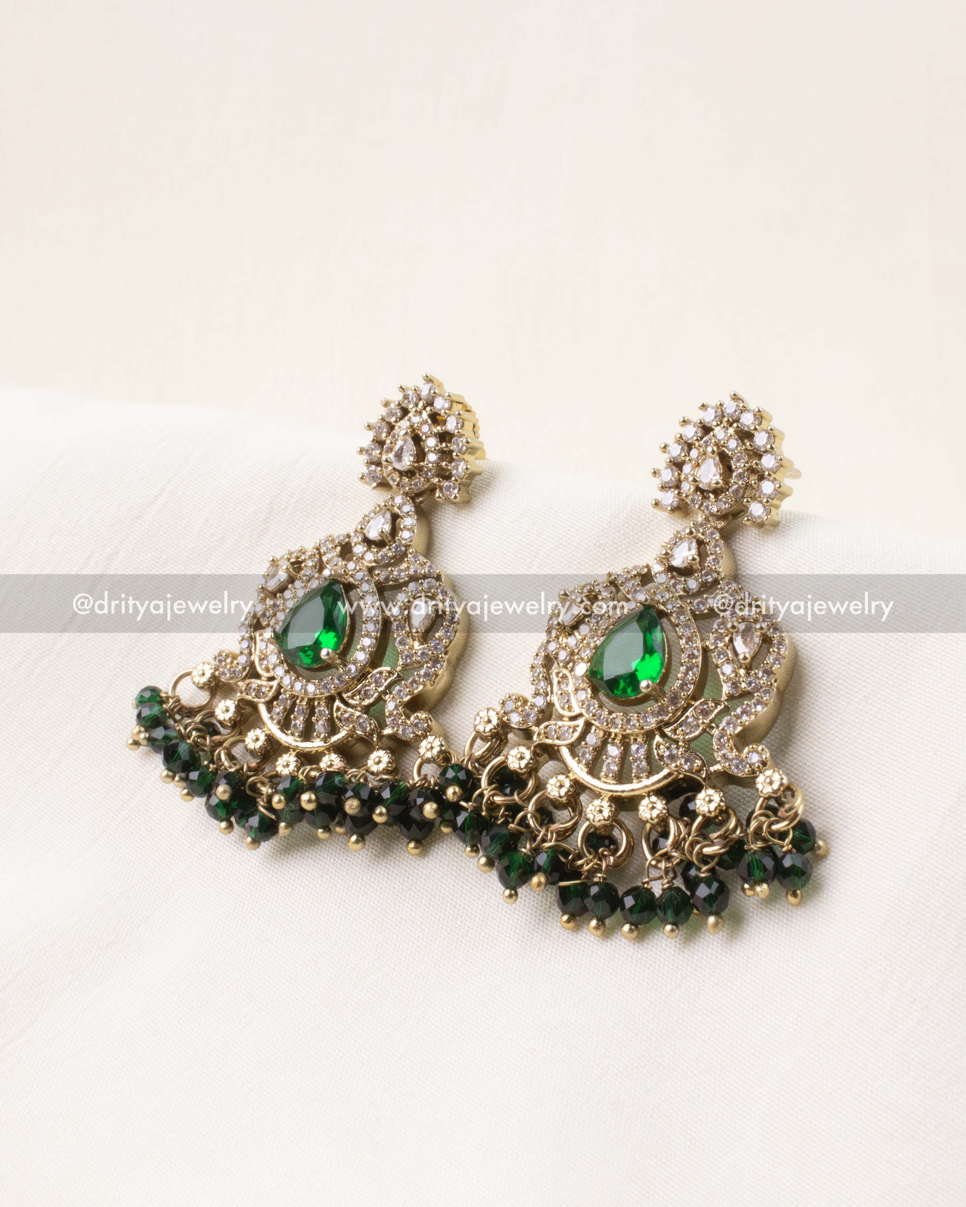 Matching emerald green Victorian earrings with AD stones and bead detailing.
