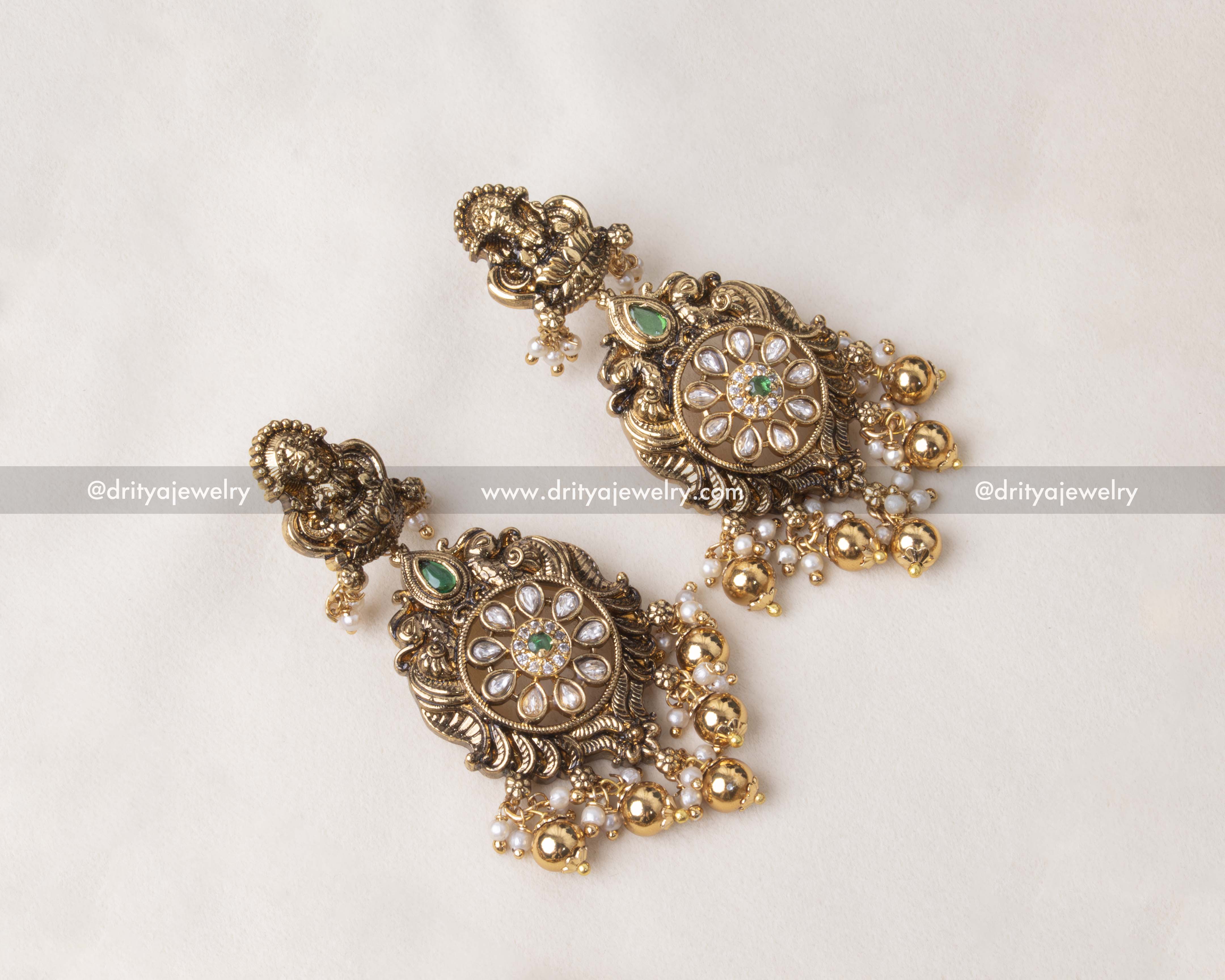 Premium Nakshi earrings with floral design and dangling pearls.