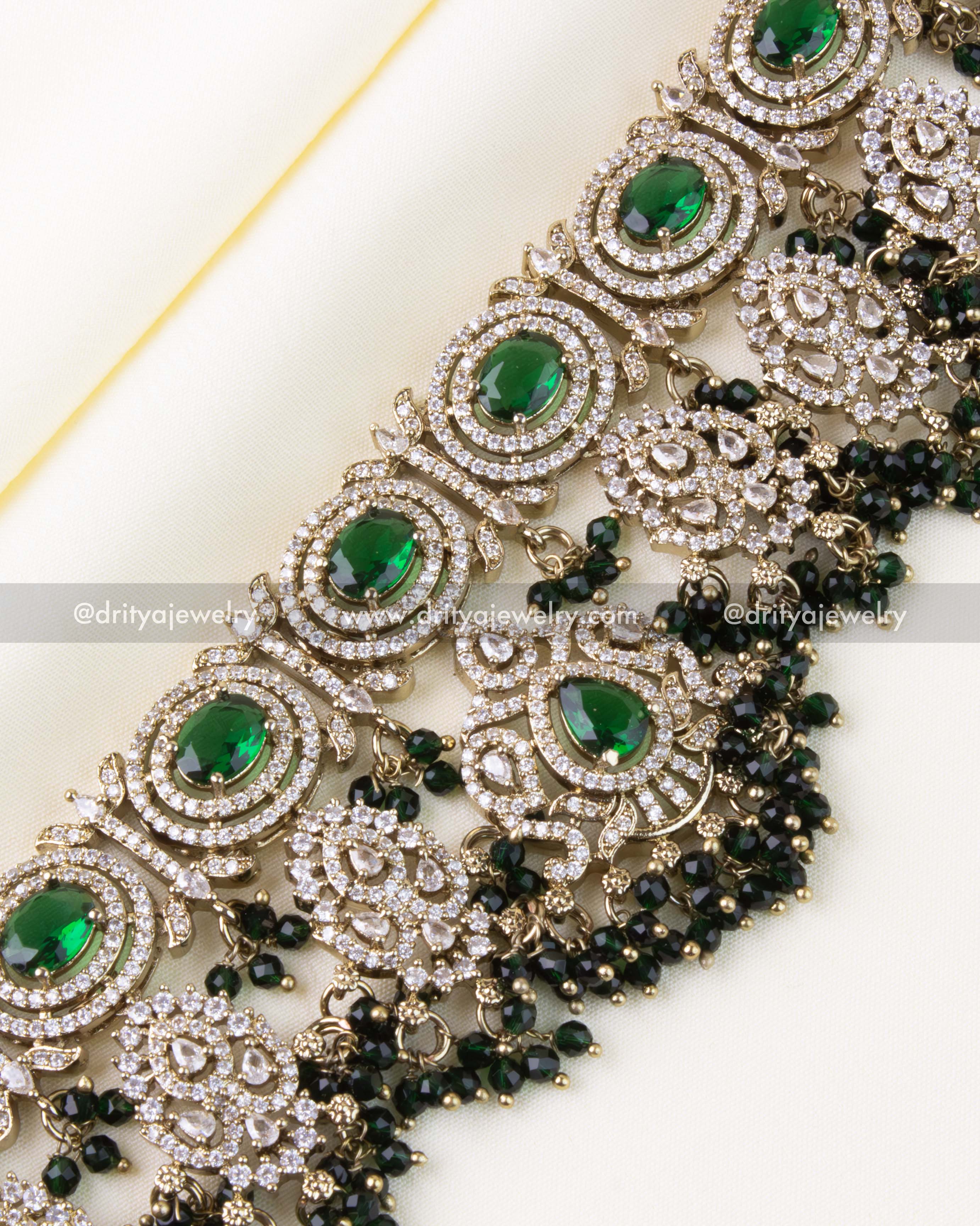 Detailed close-up of Victorian-style choker featuring green and diamond-like stones.