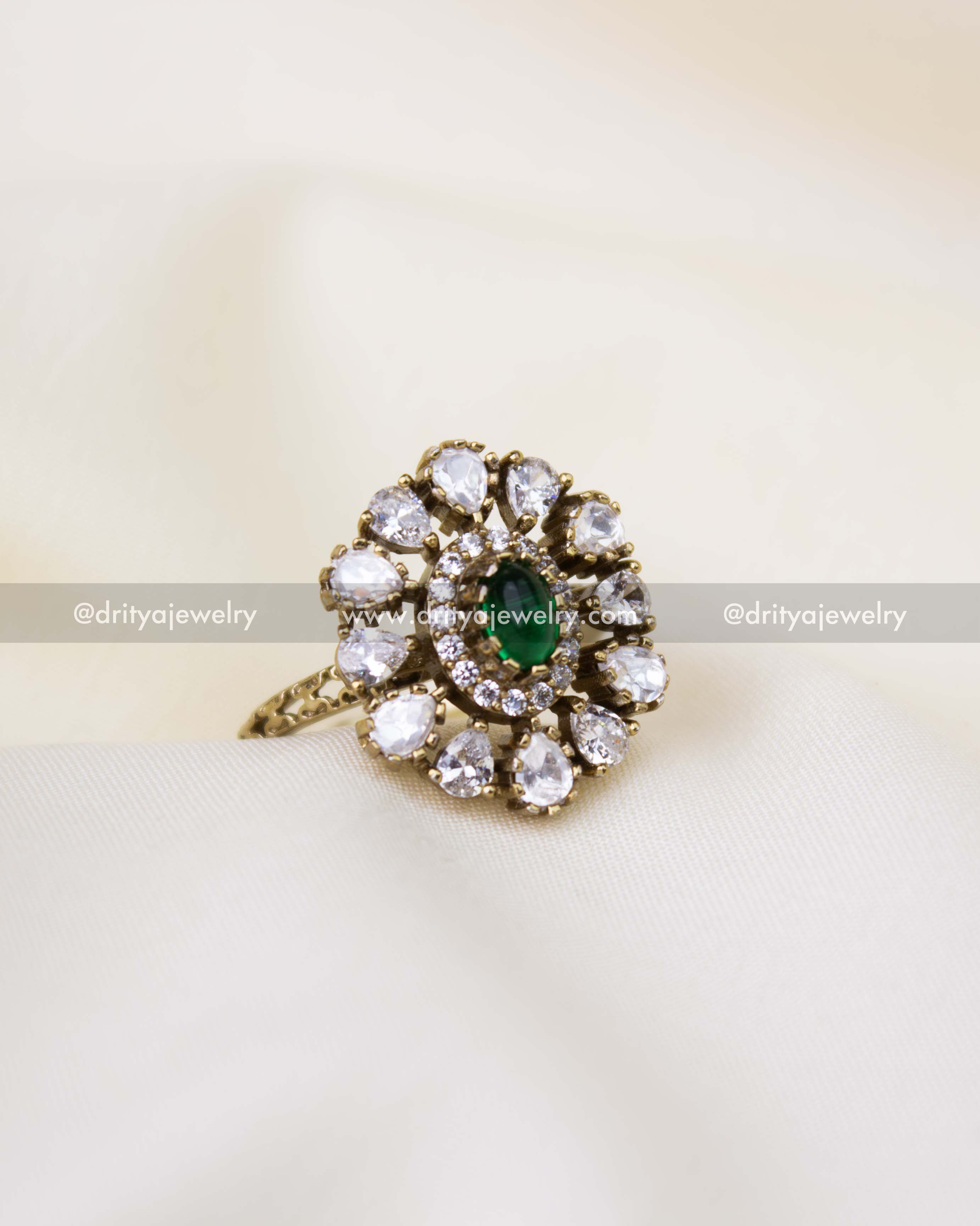 Premium traditional finger ring with green oval stone and white kundan detailing
