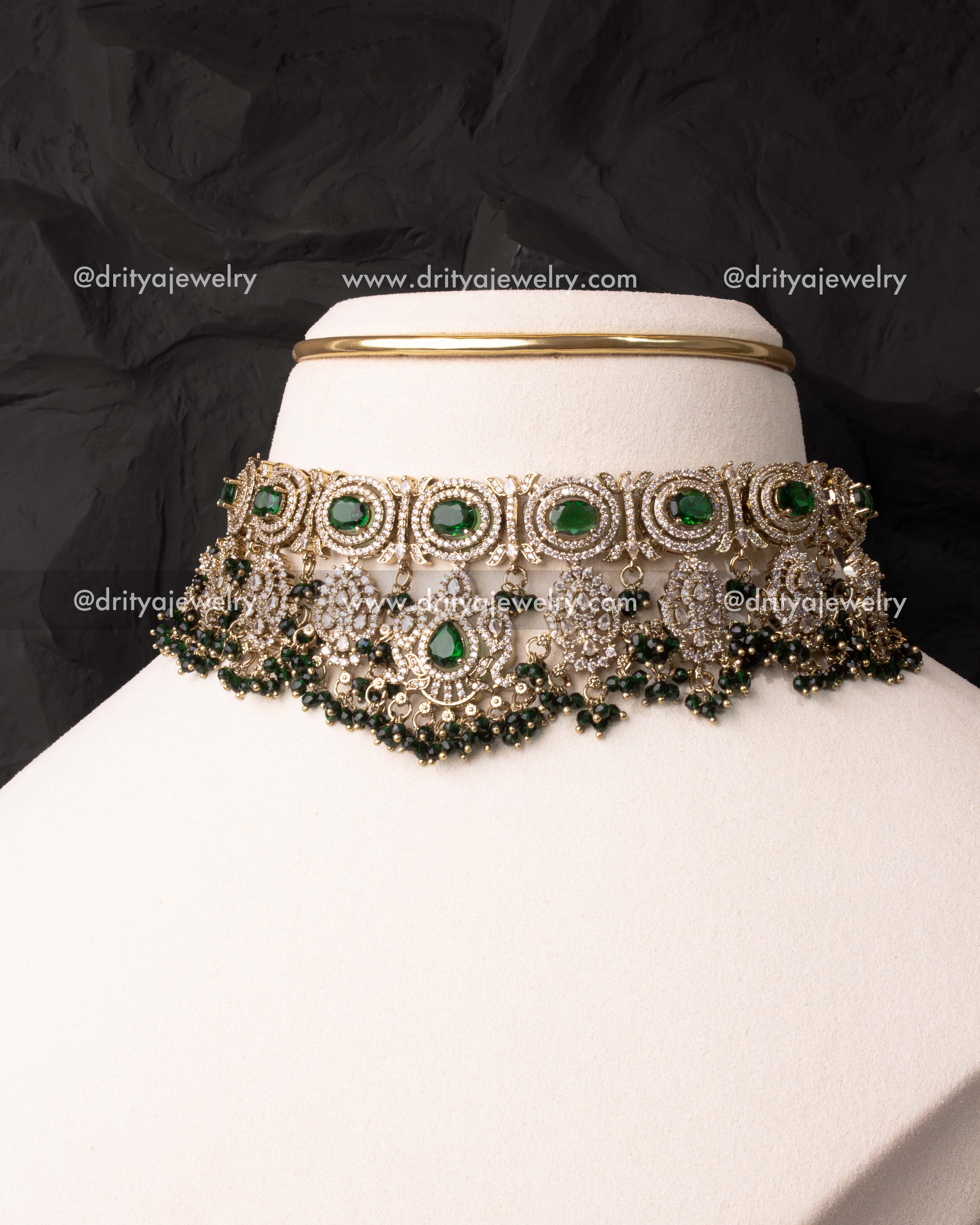 Heavy Victorian choker with green crystals and AD stones displayed on mannequin.