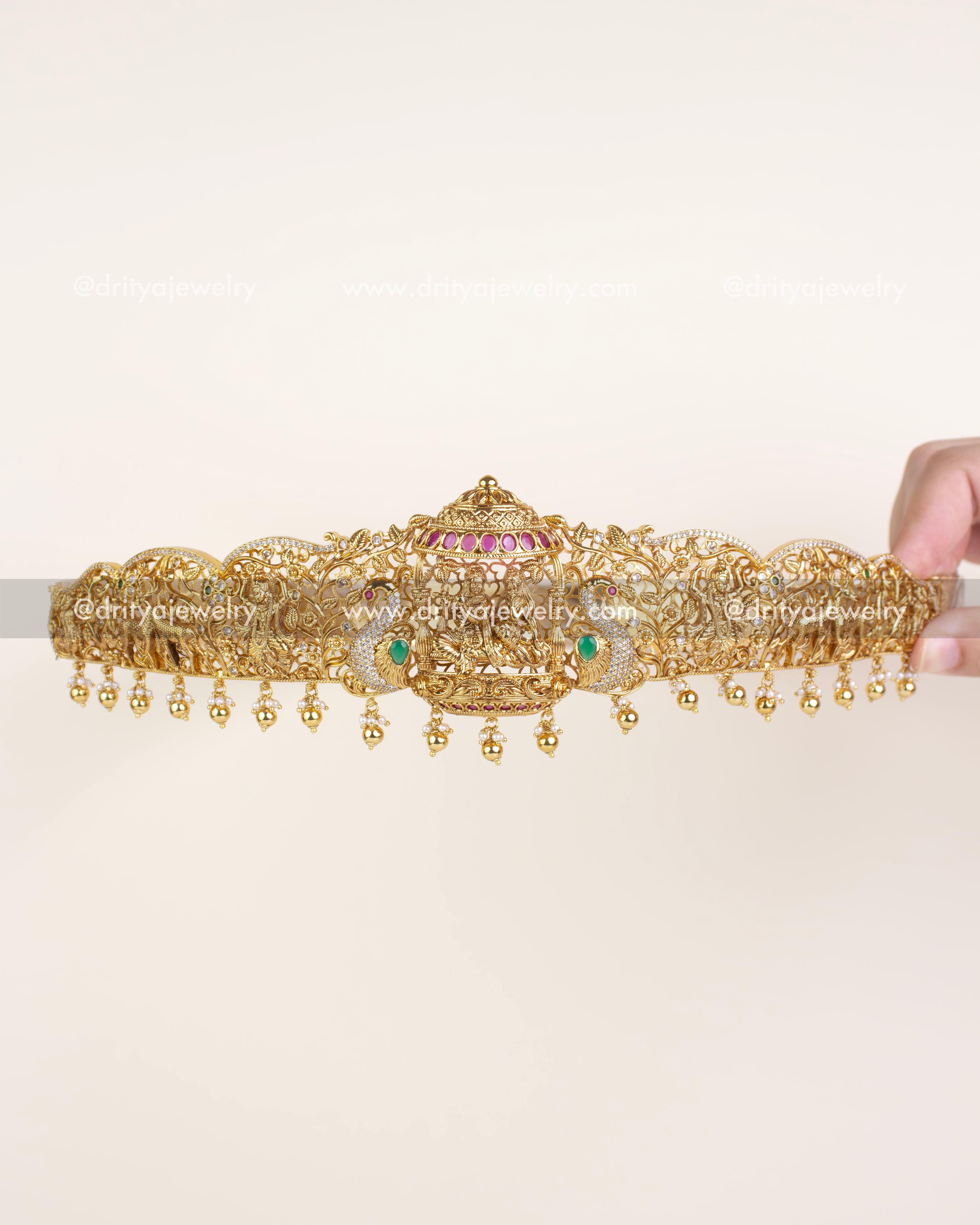 Grand Krishna vadanam with open filigree design and intricate animal, floral, and pearl elements.