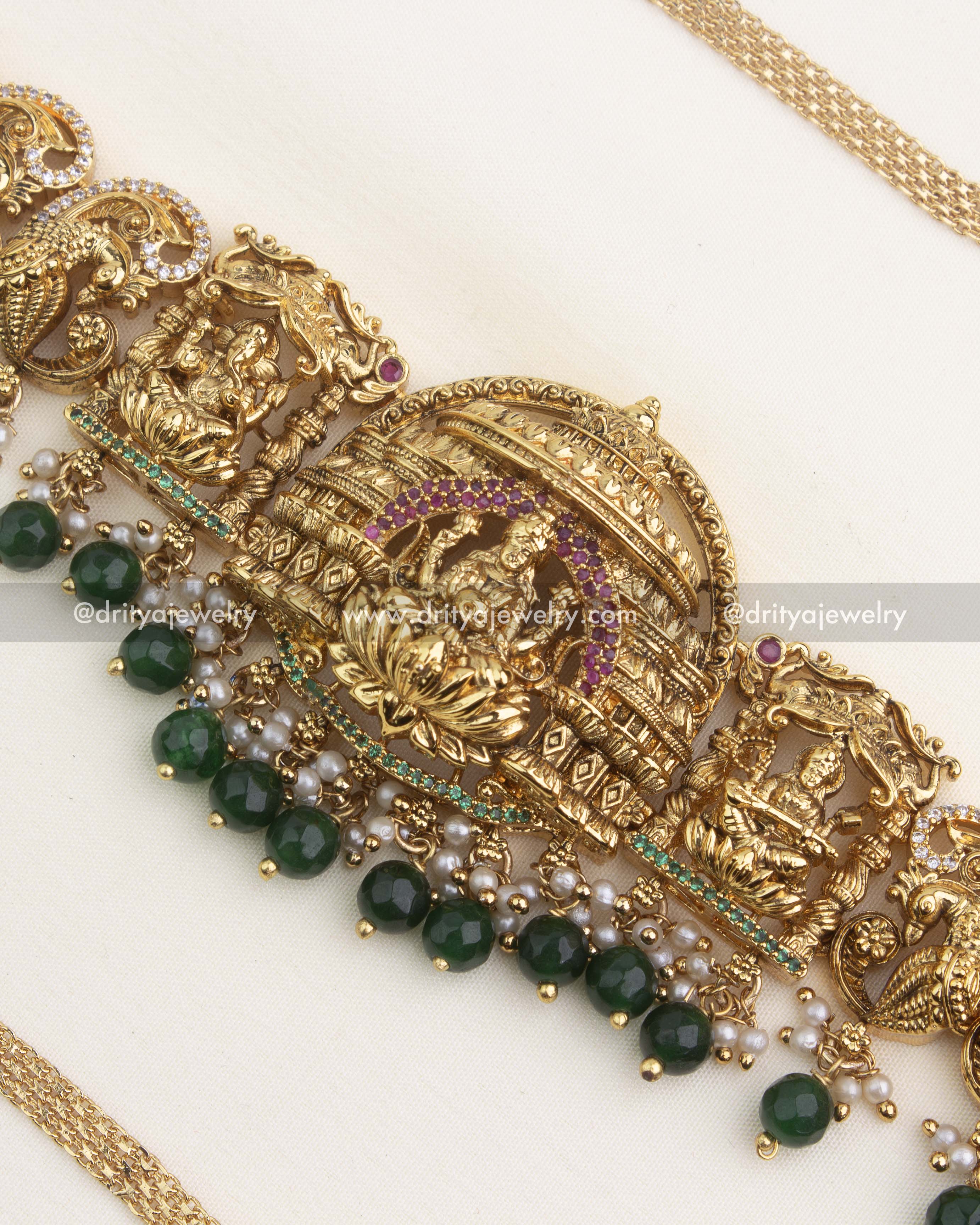 Detailed central Lakshmi temple pendant with South Indian antique finish and green bead hangings.