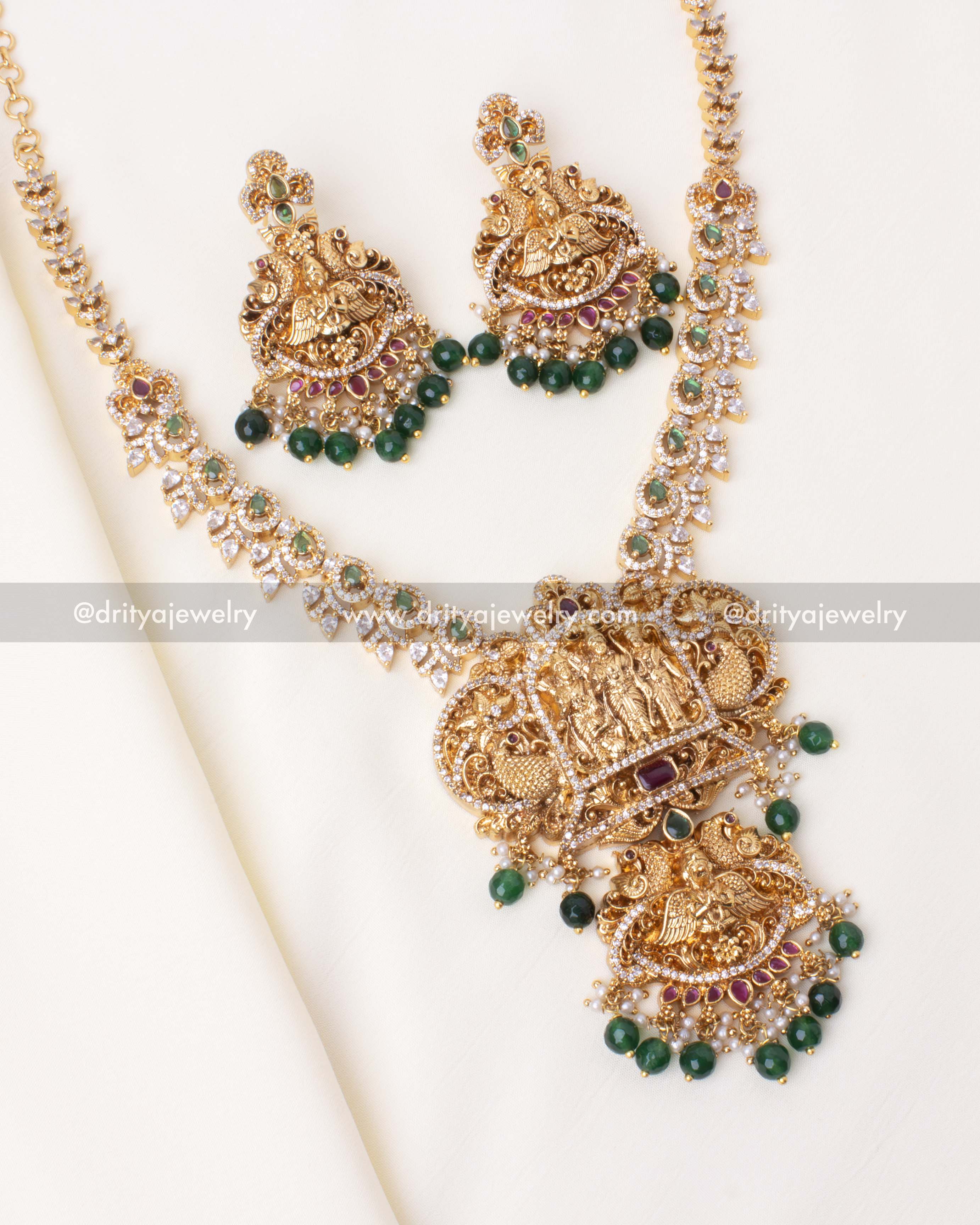 Traditional gold-plated Ram Parivar short necklace set with green accents and CZ stones.