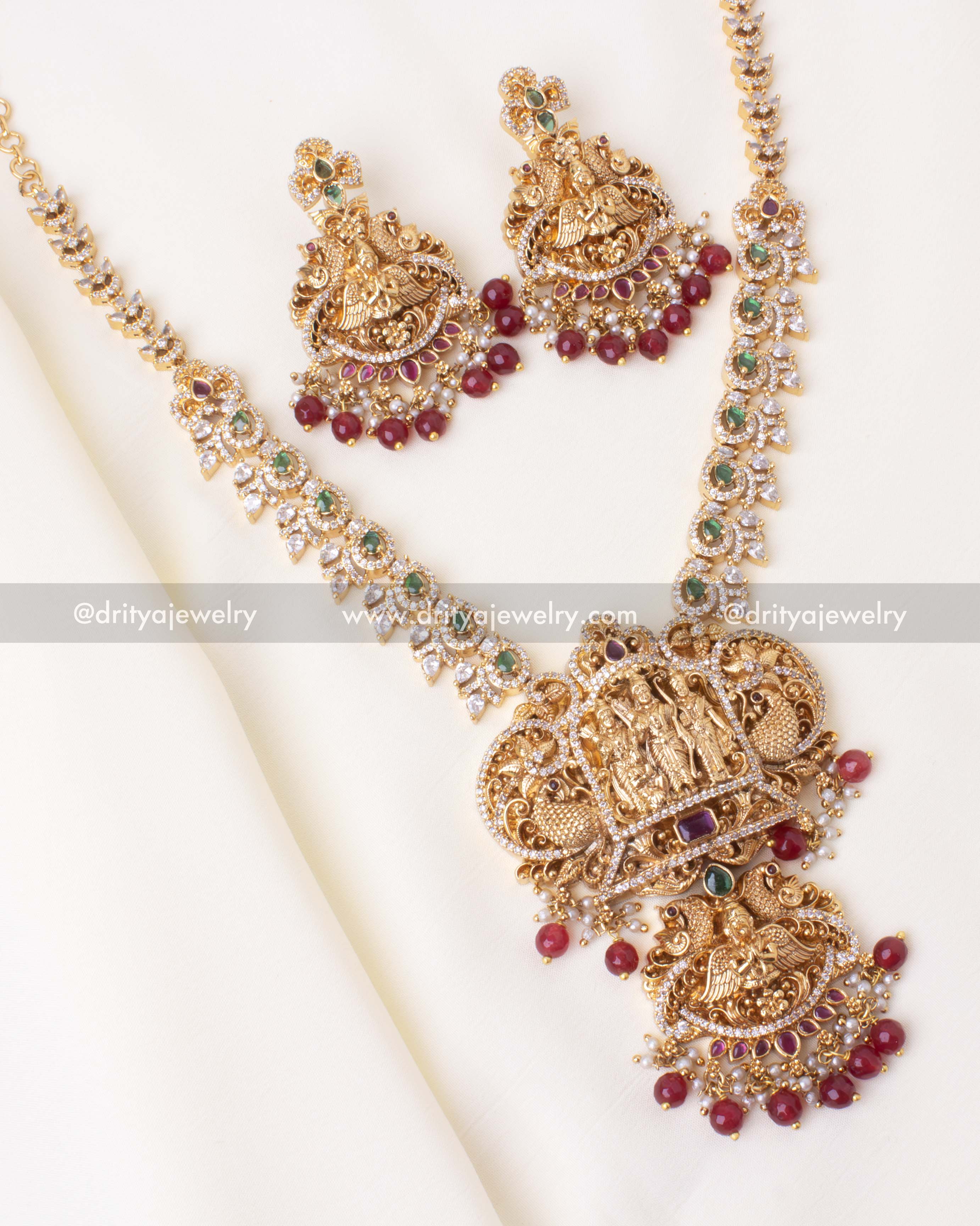 Traditional gold-plated Ram Parivar short necklace set with red accents and CZ stones.