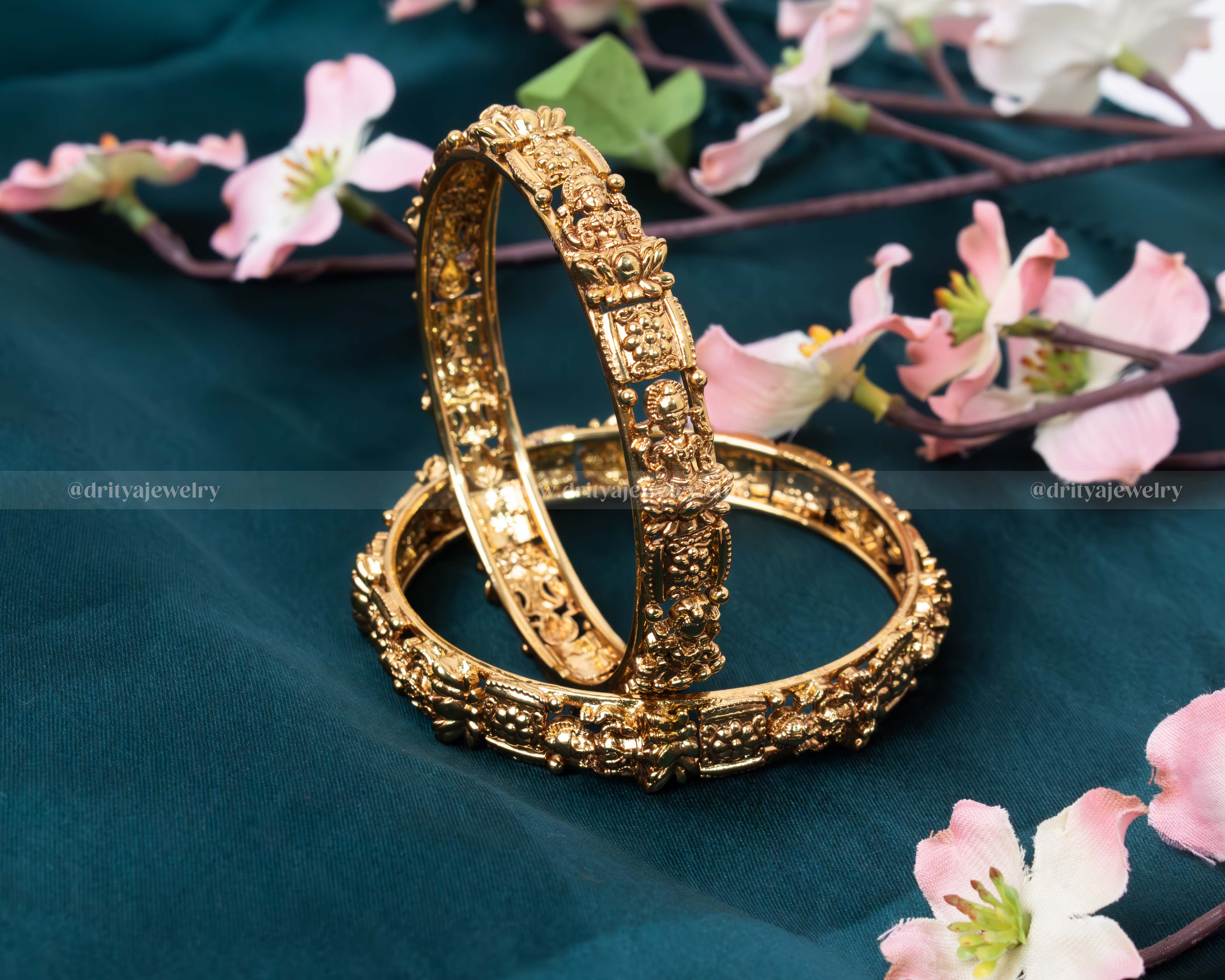Front view of the Lakshmi Devi Temple Bangle Set featuring detailed carvings of Goddess Lakshmi by Dritya Jewelry.
