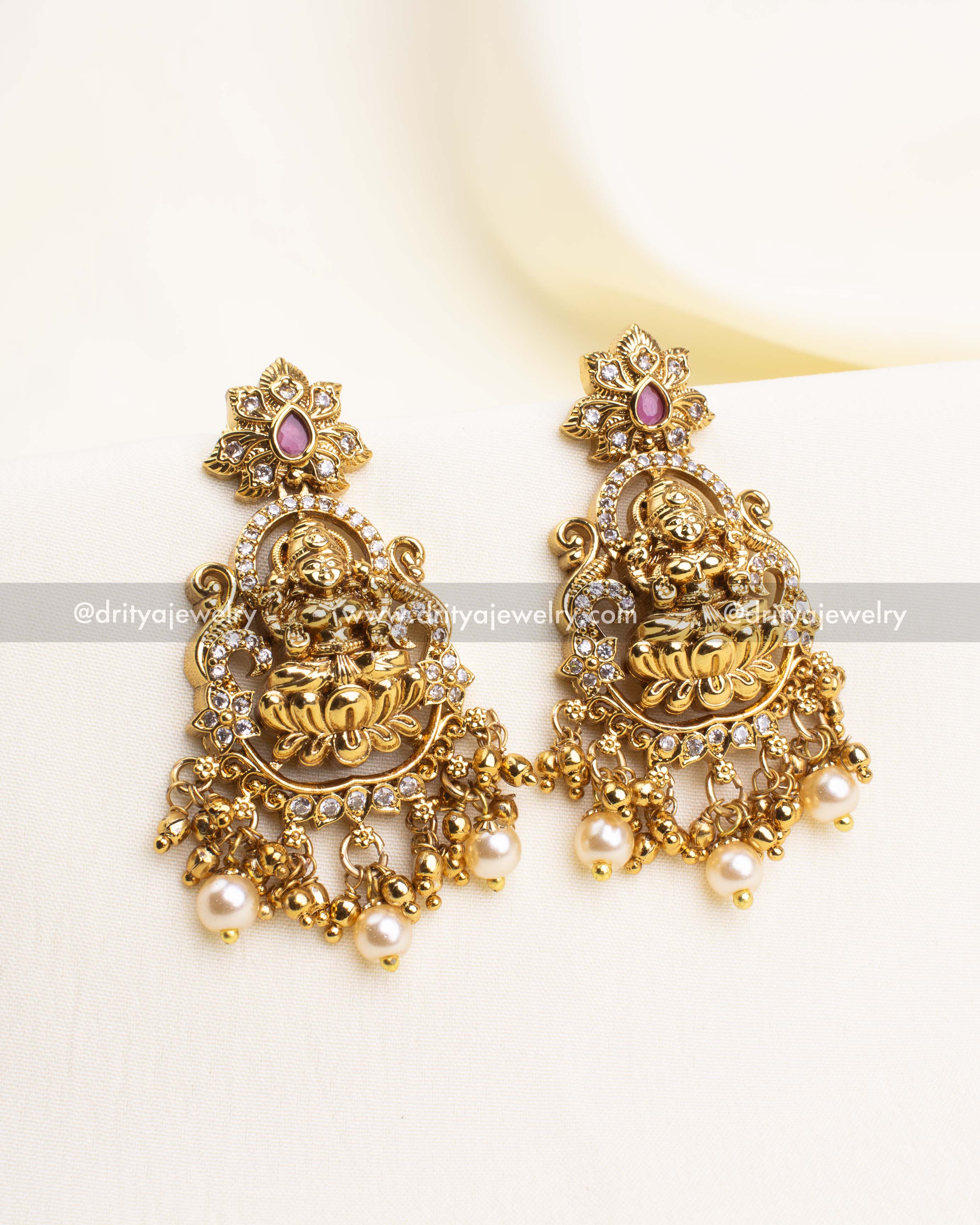 Matching temple earrings with pearl drops and CZ stones