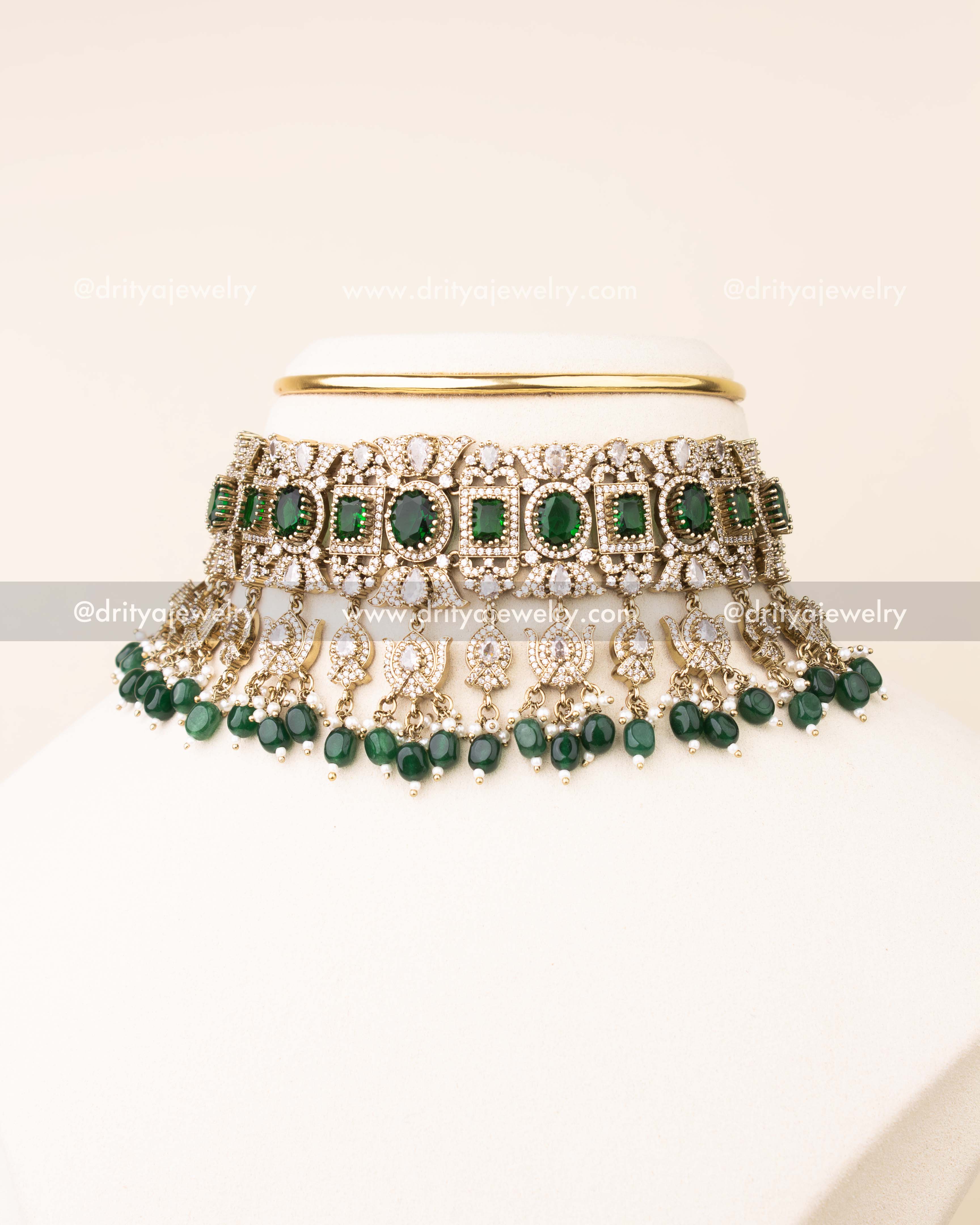 Exquisite bridal choker set with emerald green stones and matching earrings.