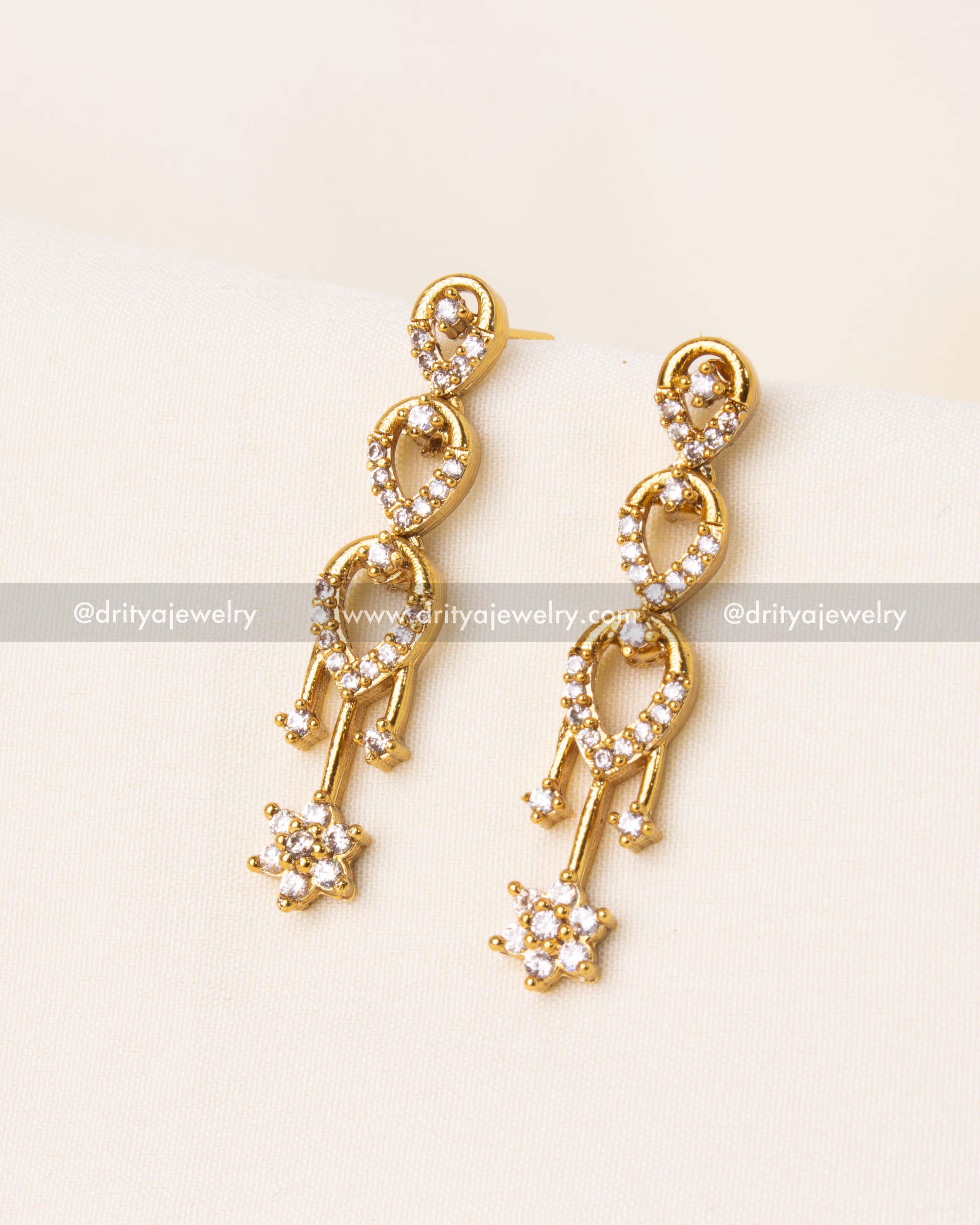 Elegant drop earrings with a cascading CZ stone design, matching the necklace set.