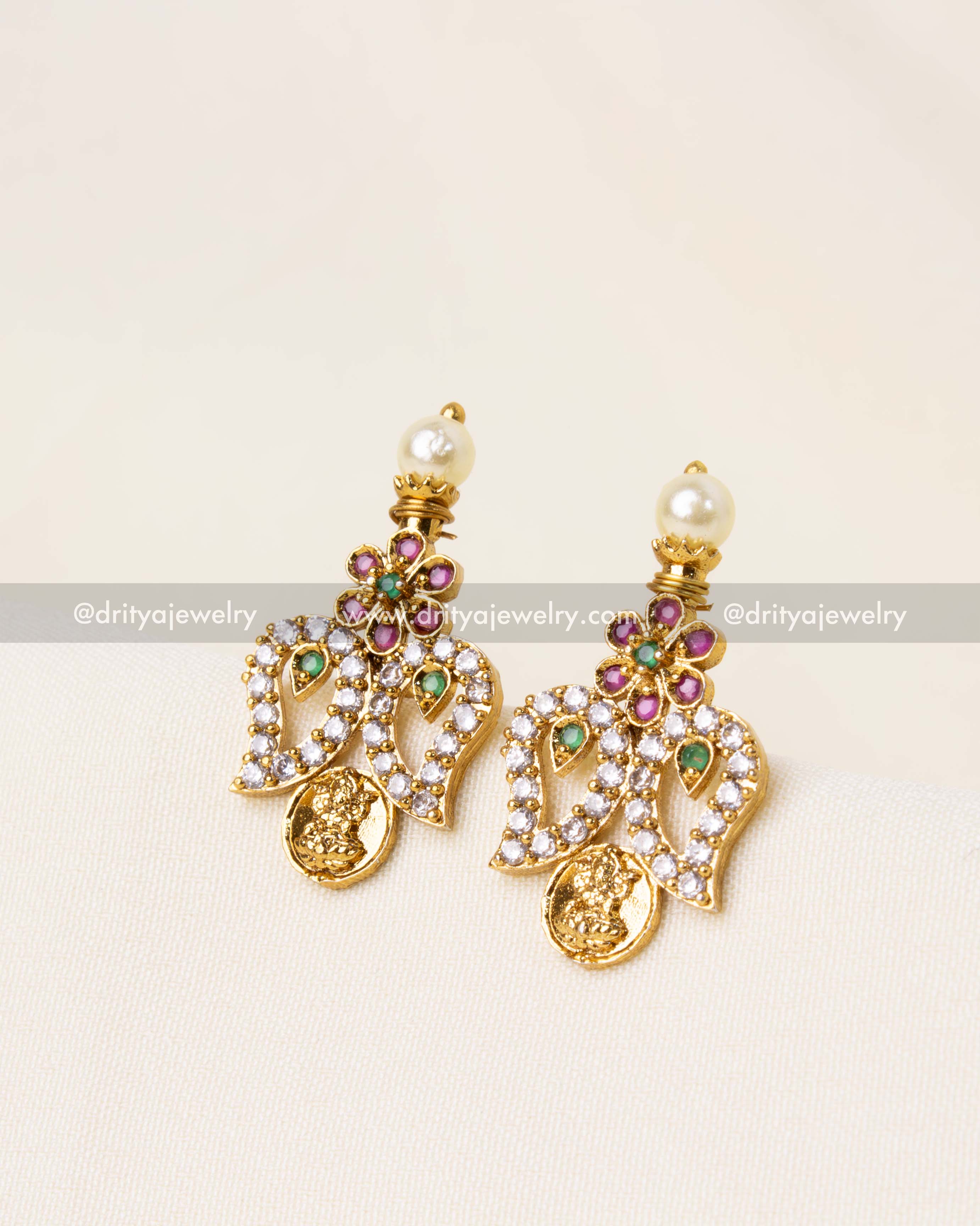 Mango motif earrings with sparkling CZ stones, floral details, and pearl embellishments.