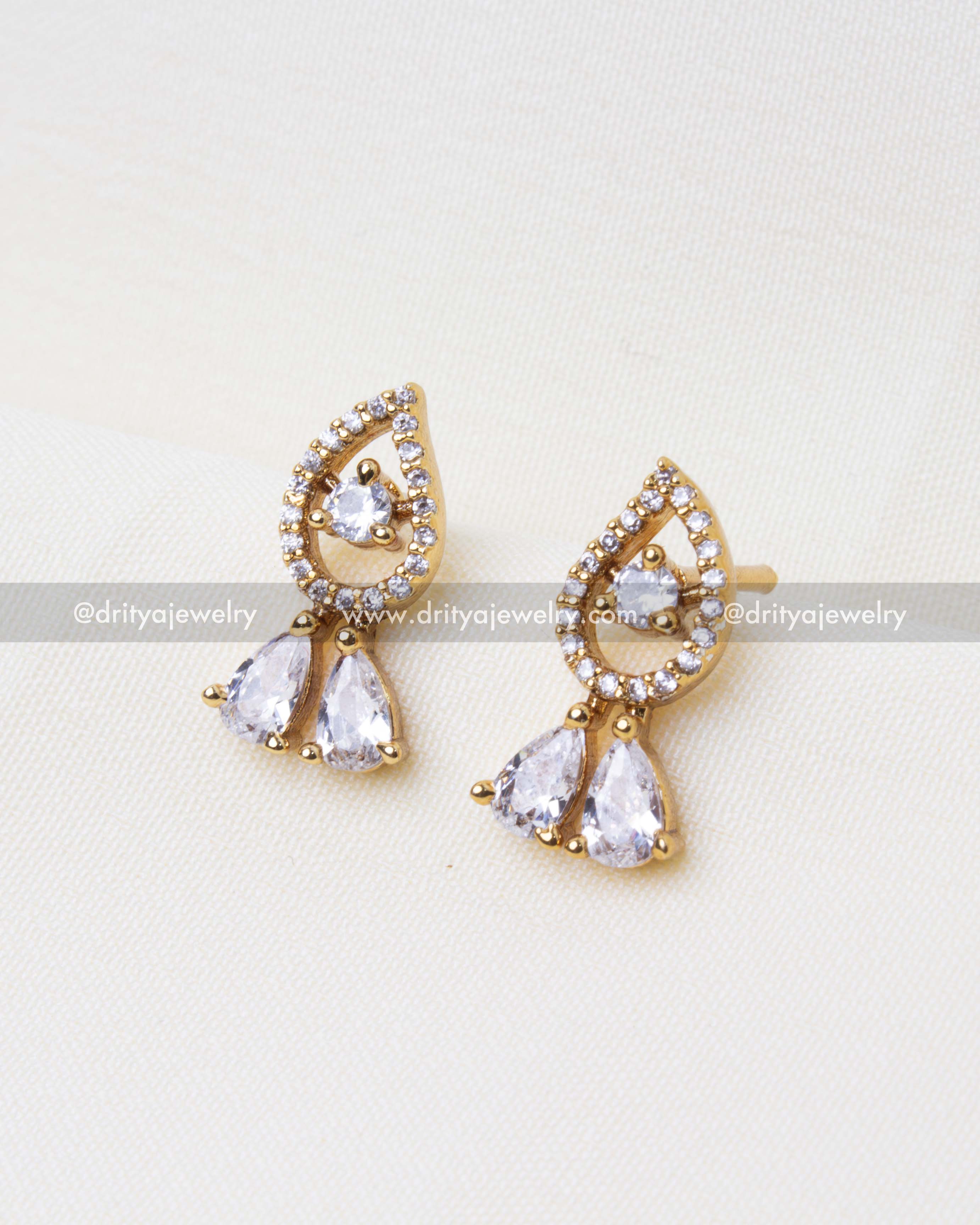 Matching CZ earrings with teardrop design