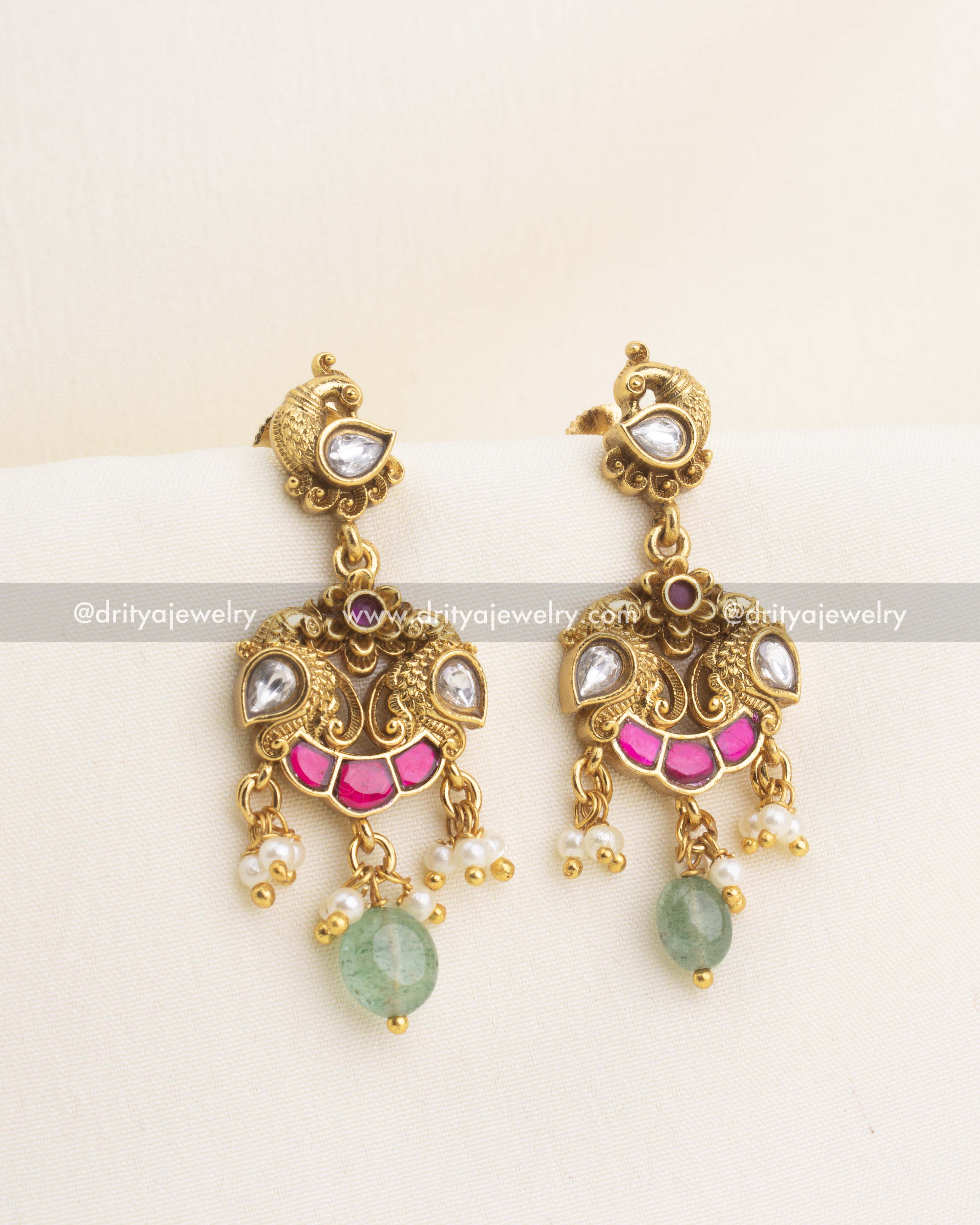 Idol-free kemp earrings with peacock motifs, polki kundan stones, pearl clusters, and green bead drops