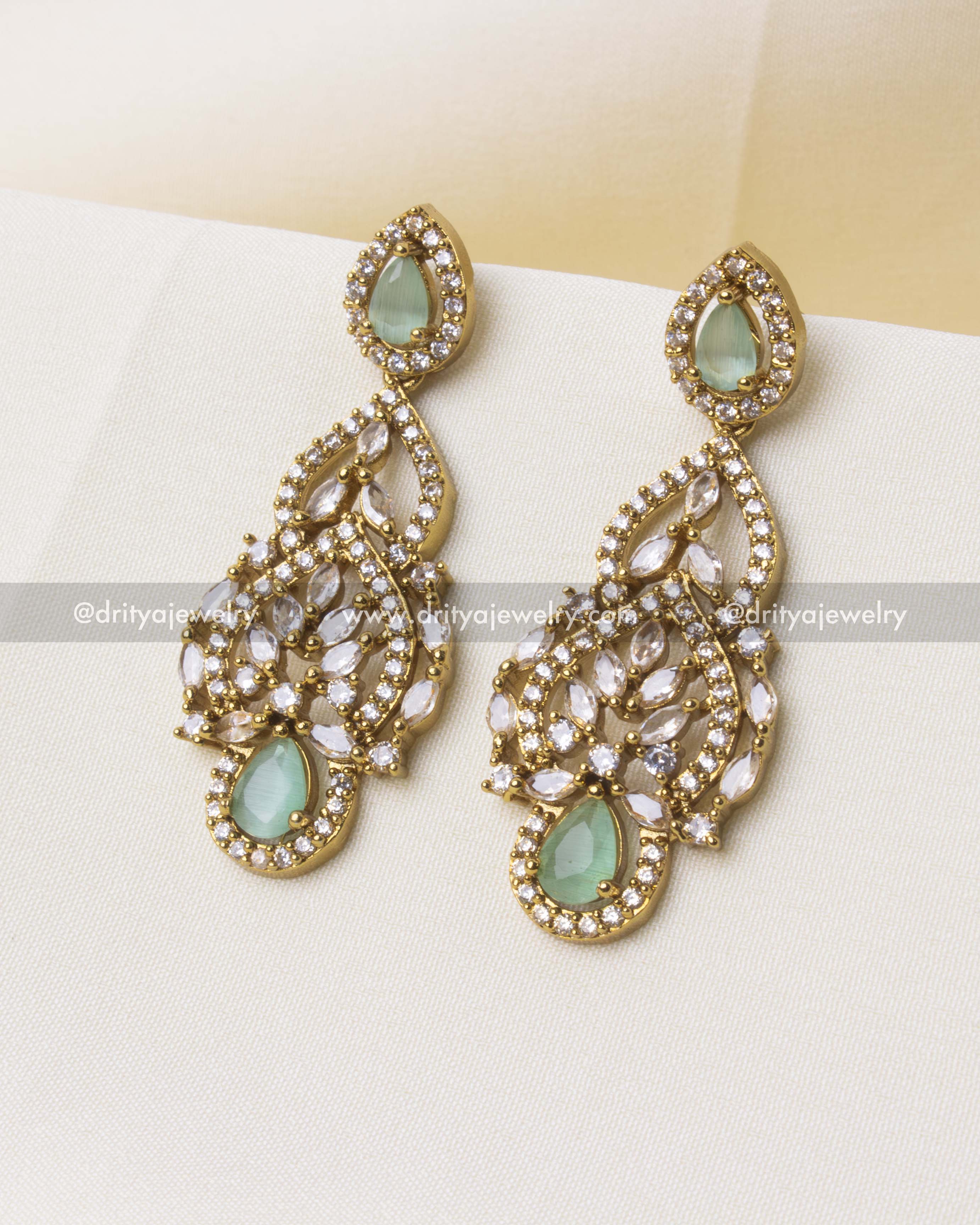 Long-drop Victorian earrings with mint teardrop stones and CZ accents.