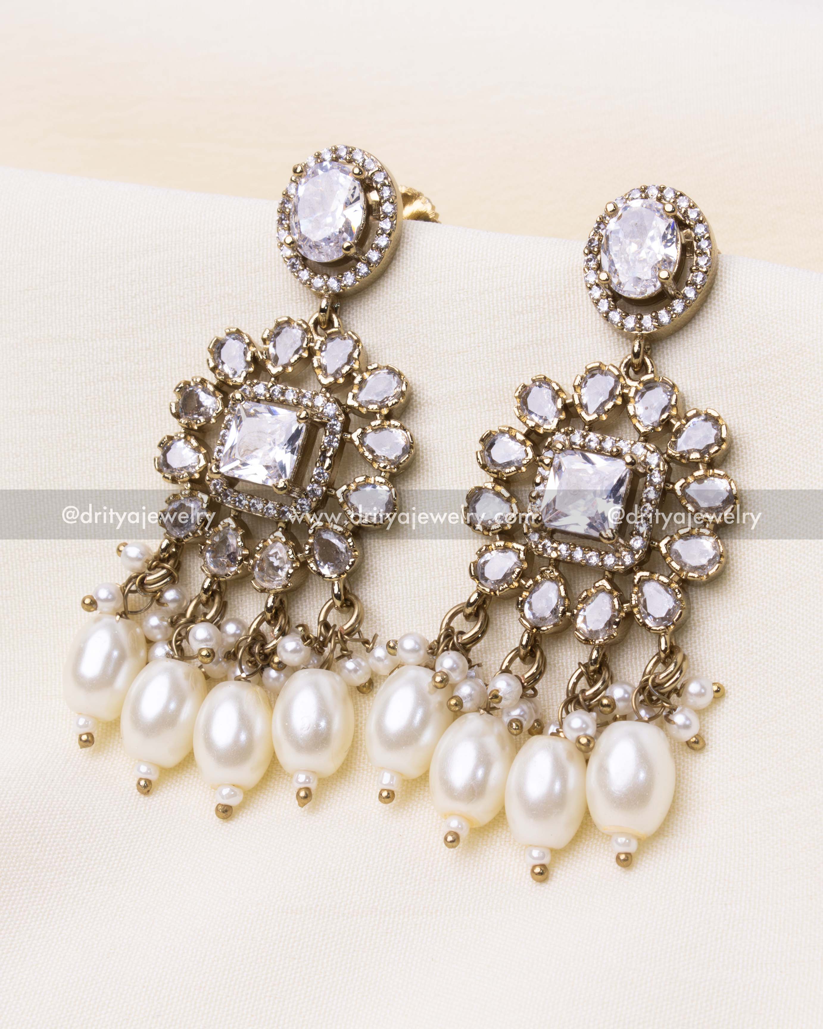 Coordinated earrings with floral design and pearl embellishments complementing the choker.