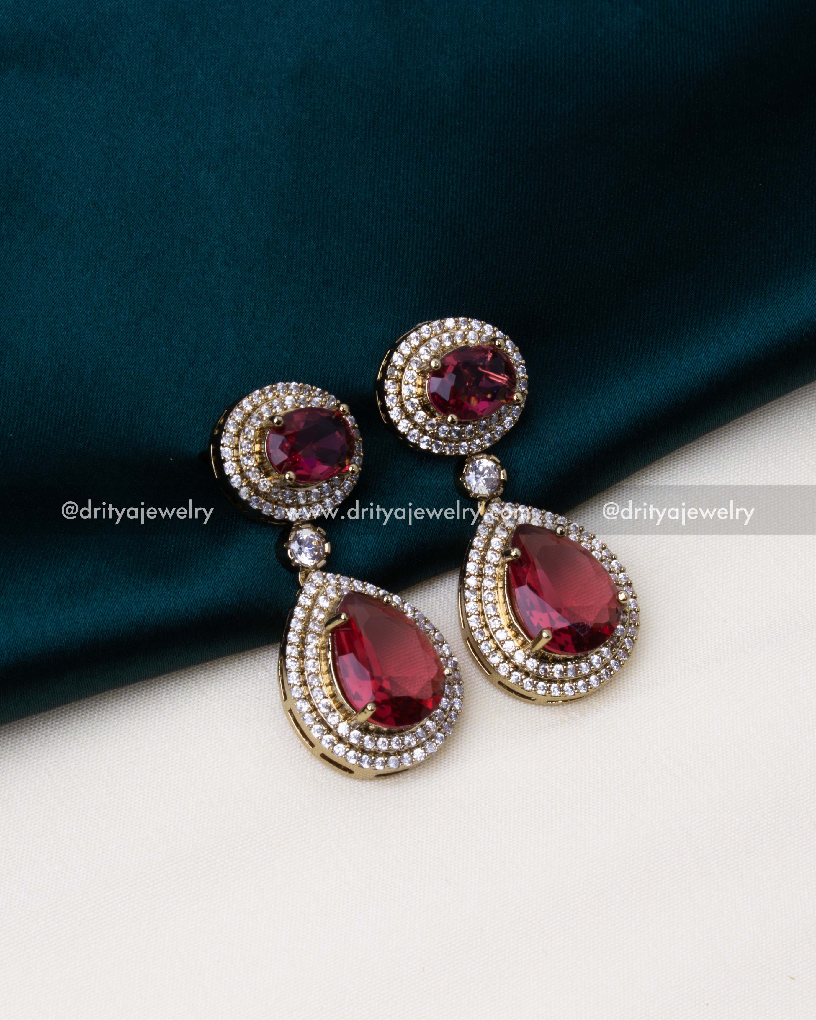Elegant ruby drop earrings with CZ embellishments, a perfect match for the necklace.