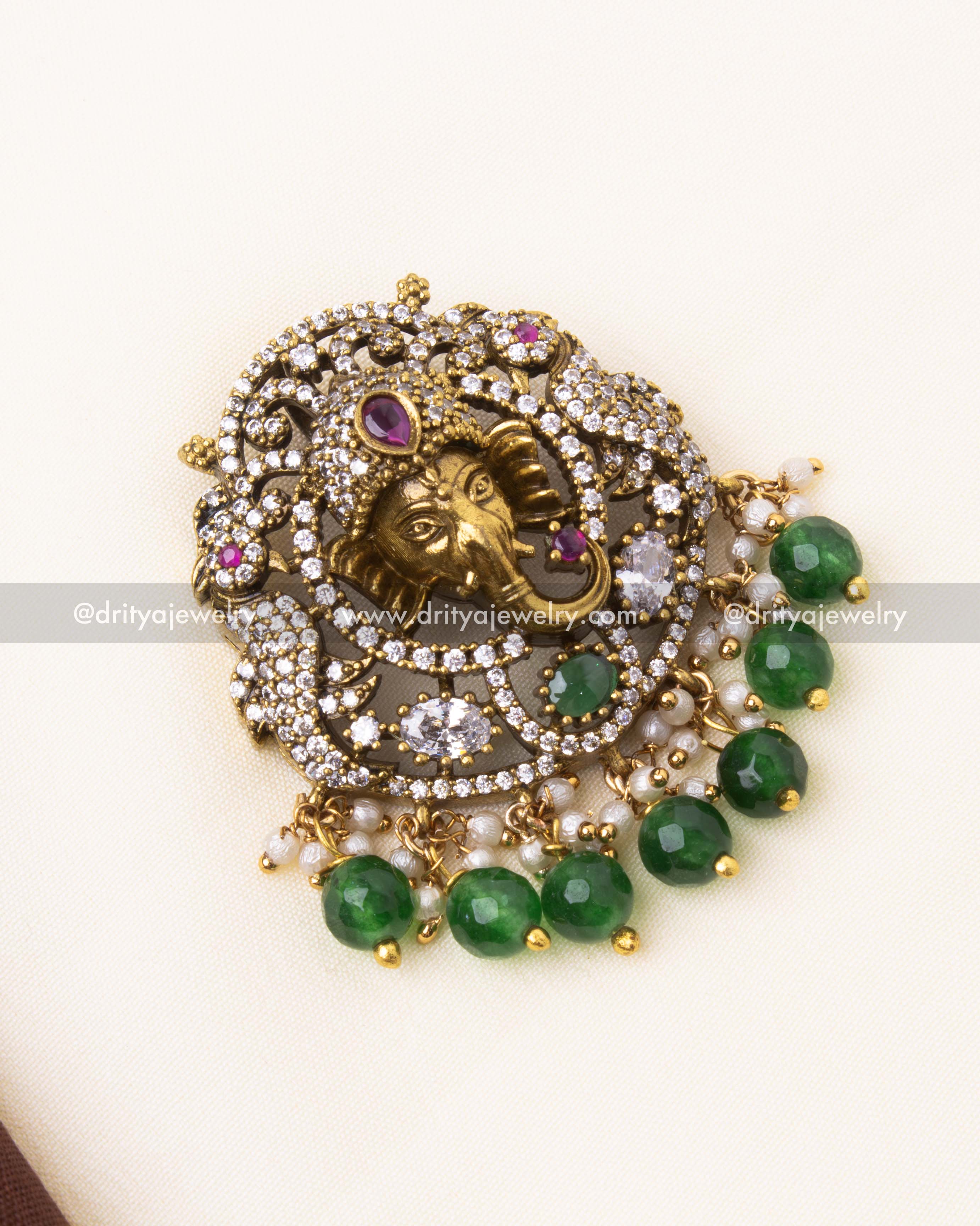Elegant Mehndi-finished Victorian pendant featuring Lord Ganesha motif with CZ stones and green bead hangings.