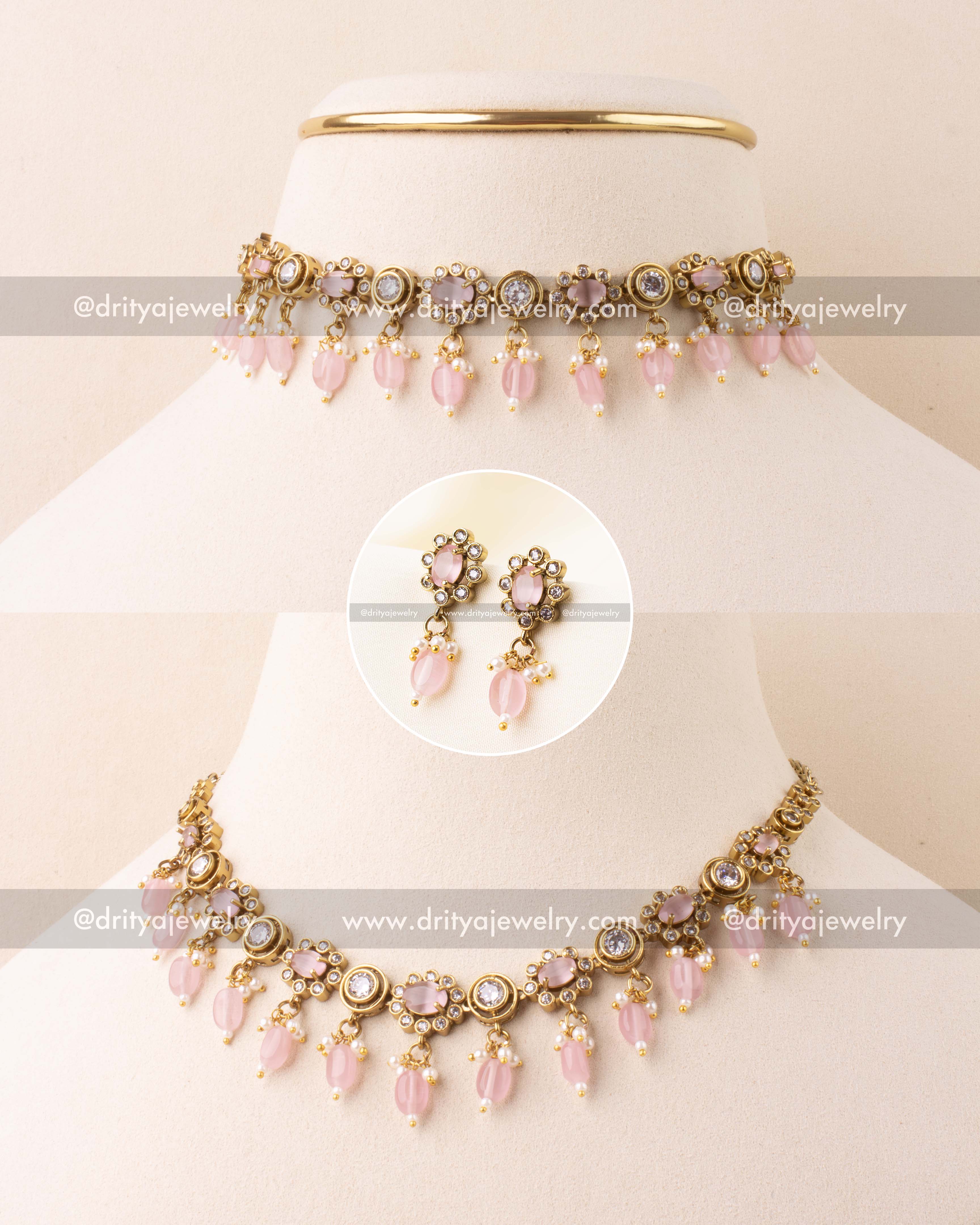 Blush pink choker necklace with AD stones and bead danglers in antique gold finish.