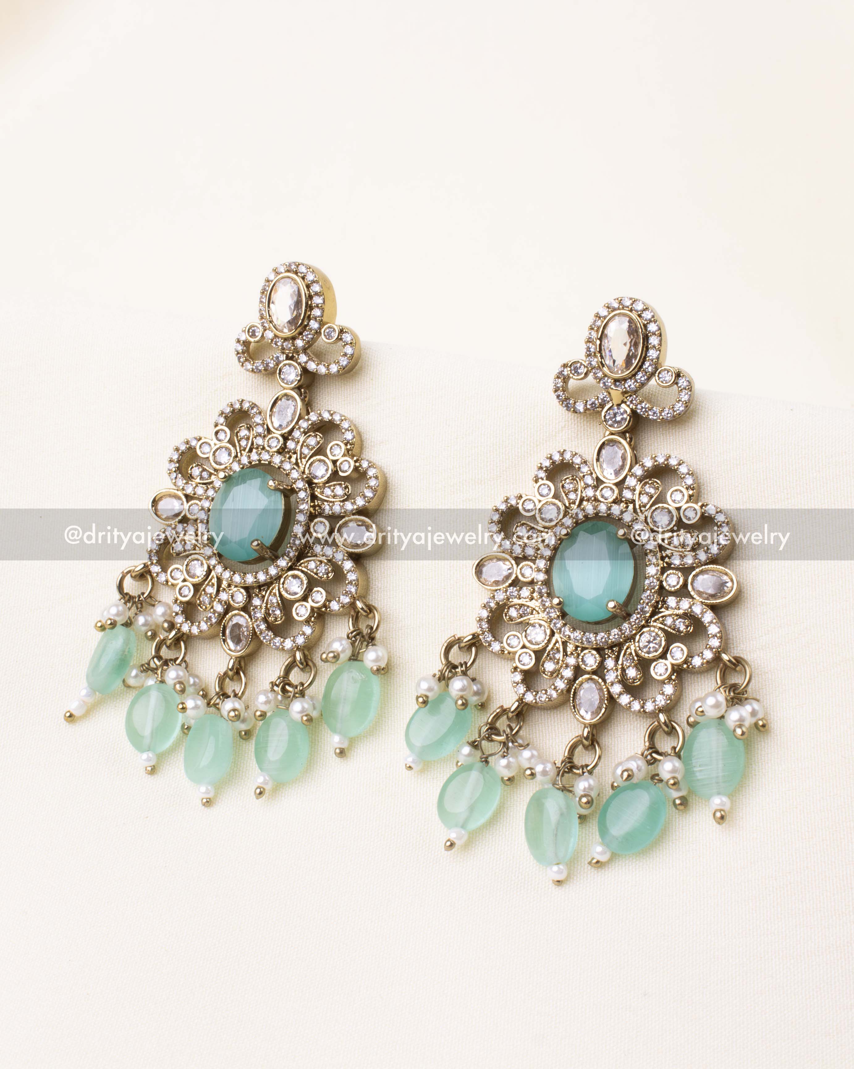 Elegant Victorian earrings with mint green center and beaded fringe.
