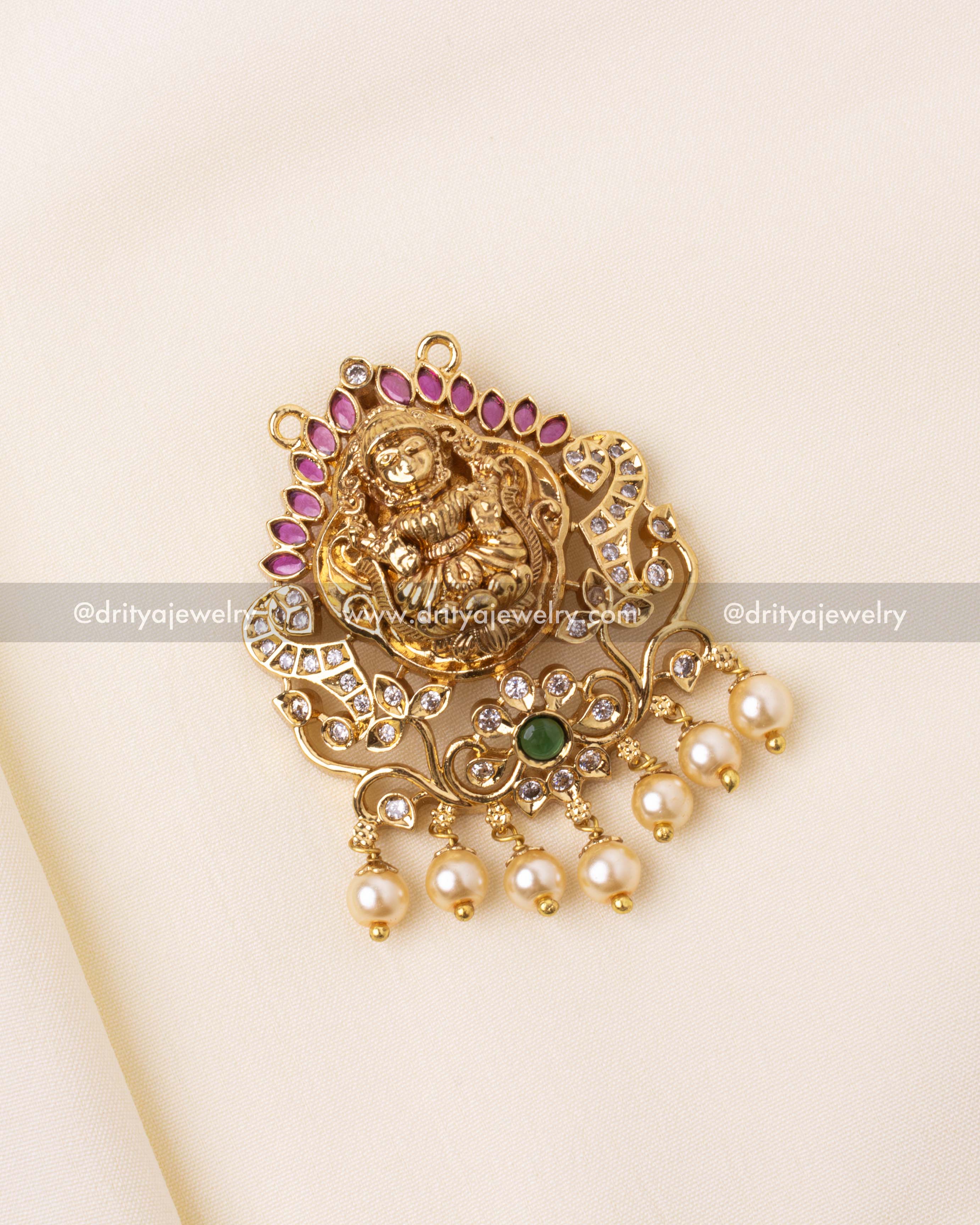 Elegant Nakshi pendant featuring a Goddess motif with pink stone accents and pearl hangings.